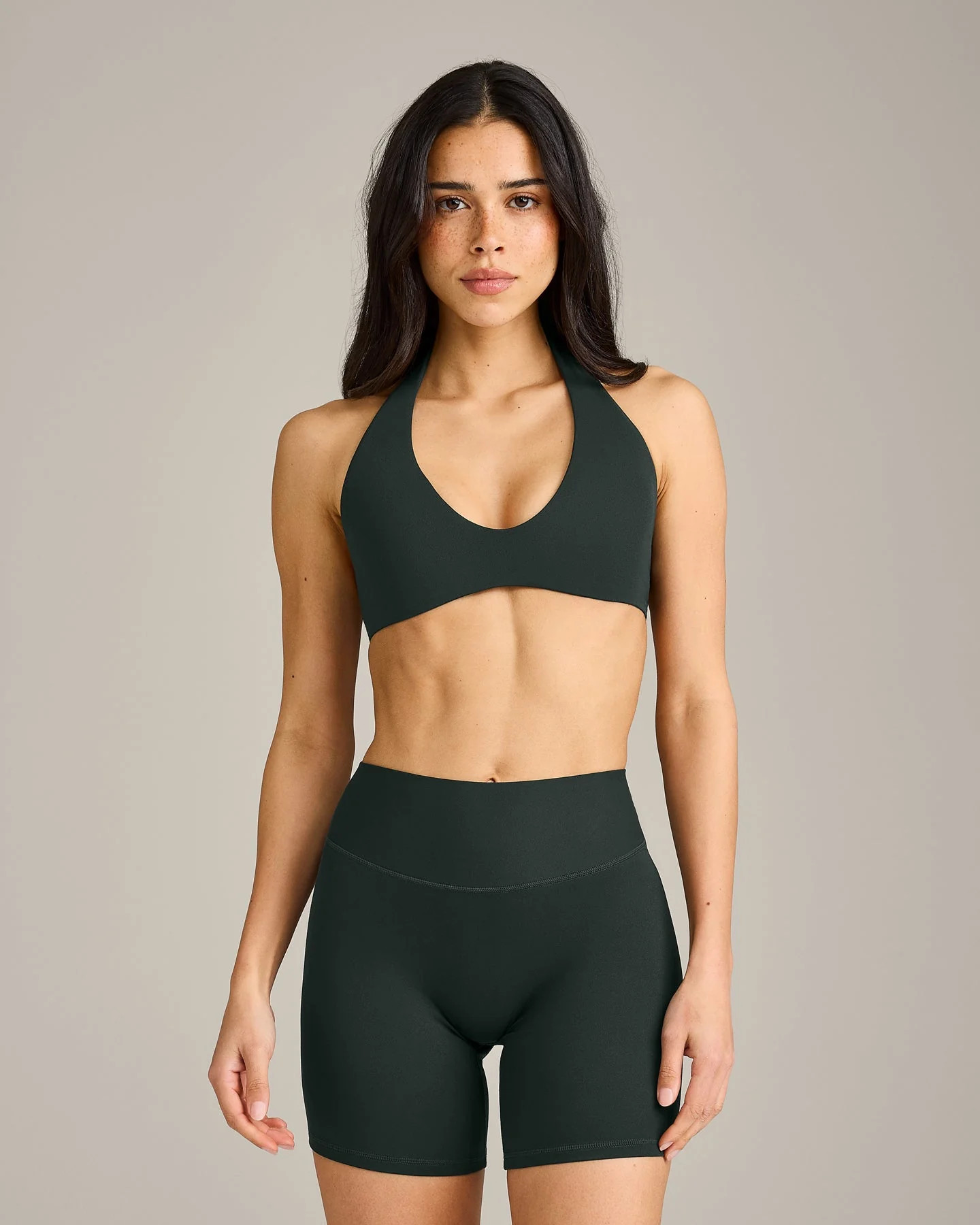 SoftMotion\u2122 Minimal Halter Neck Bralette with Grey Logo 
 Emerald Noir | Oner Active (UK / US)