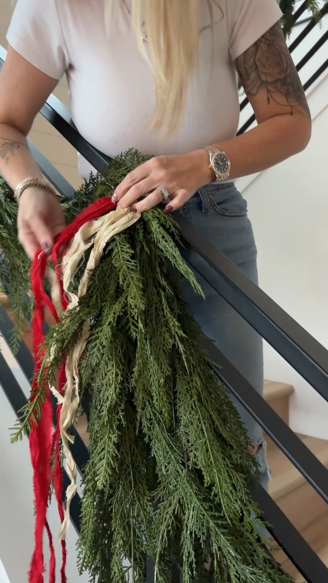 How I add ribbon to me staircase garland and wreaths on the back of my barstools 

#LTKHome #LTKFindsUnder50 #LTKHoliday