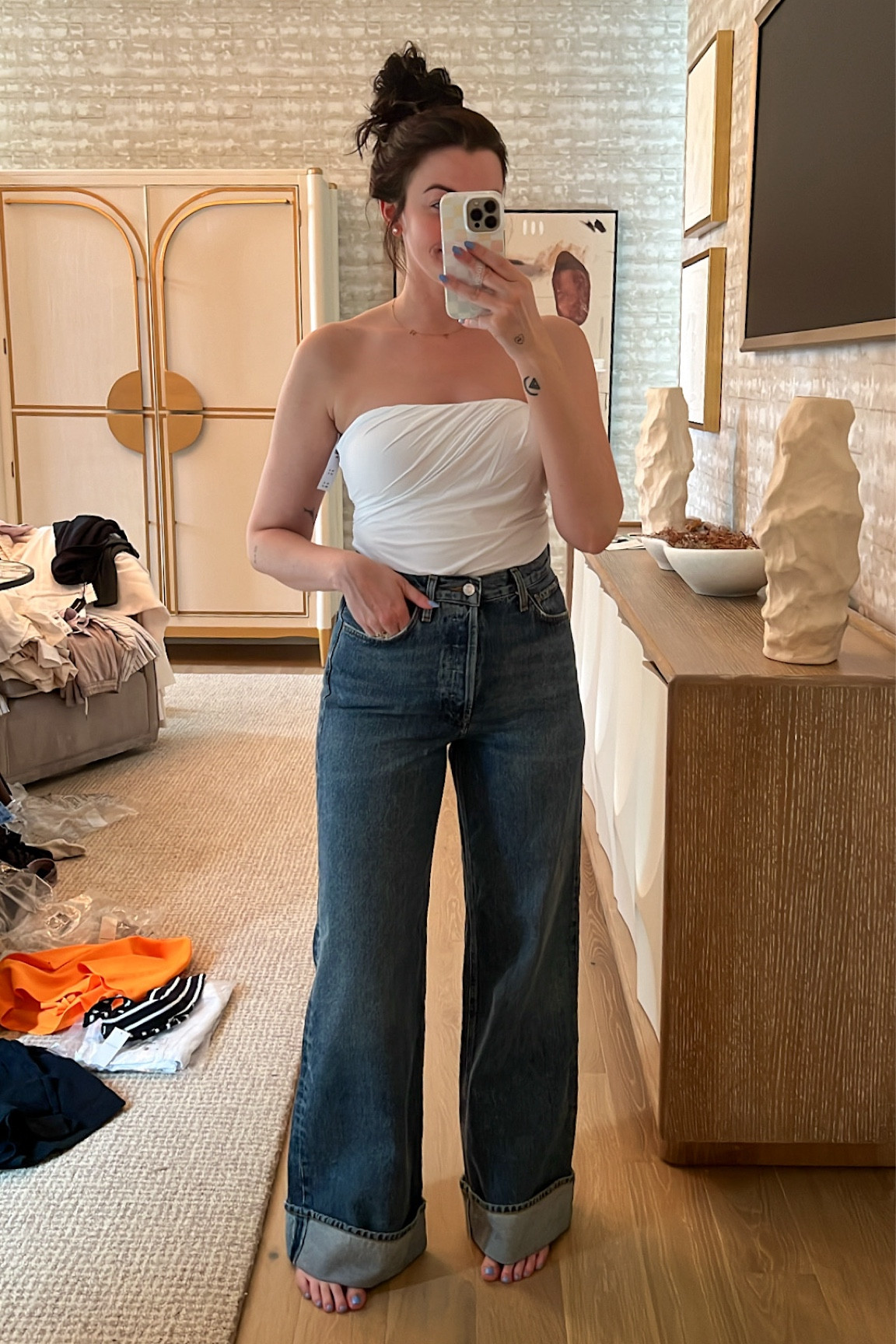 I sized down 2 sizes in the jeans! They’re snug through the hips, but I don’t think I’d size up. Tube top is a small 

#LTKStyleTip