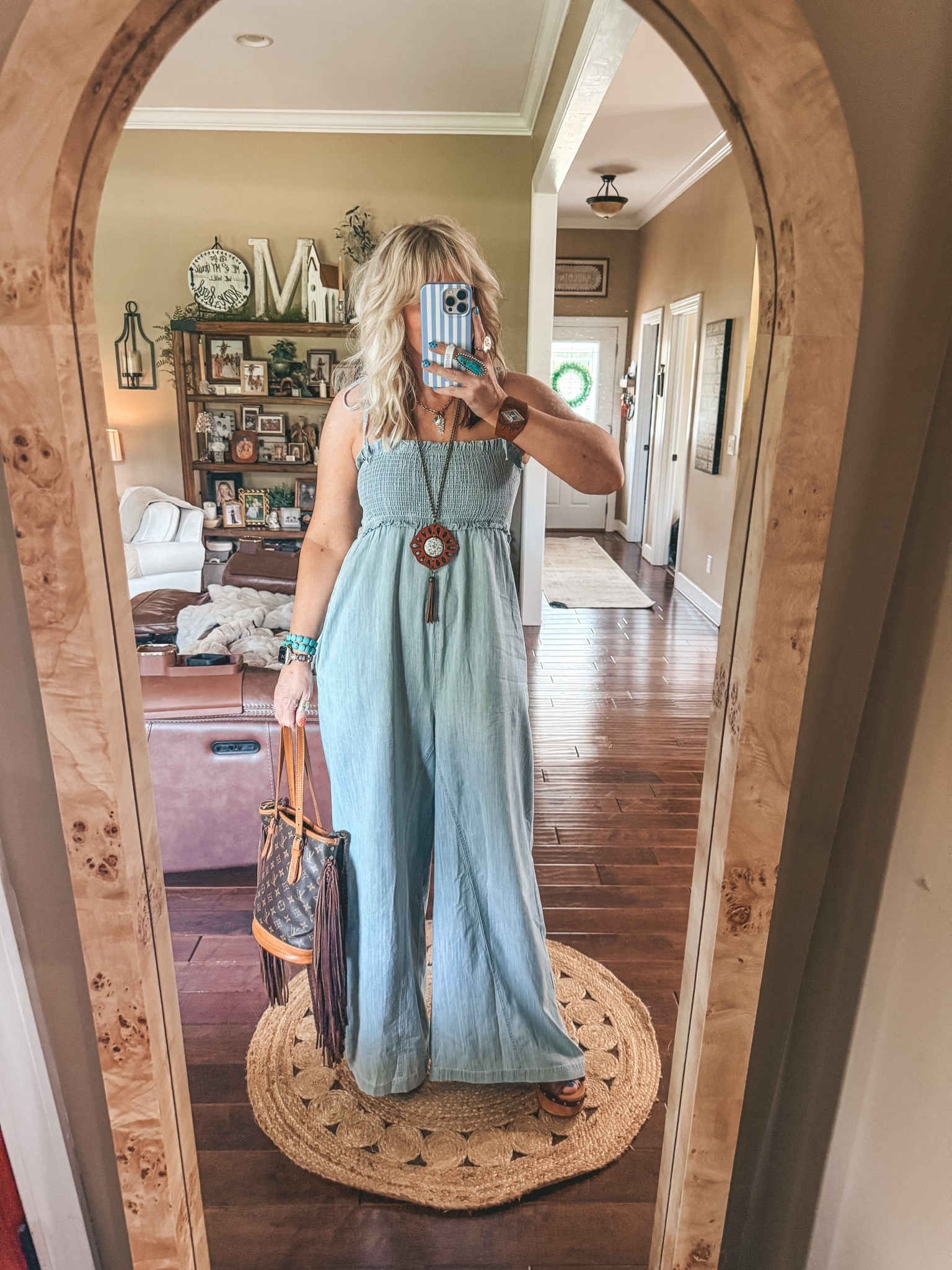 The cutest denim jumpsuit! This one can be worn with straps tucked in to have a strapless look. Tie the front two and tuck the back ones to have a halter look. Wear a fitted tee underneath. 
I’m in a medium. 

✨Use code MANDIE20MAULDIN if it’s not on sale already @Three Bird Nest 
💼My bag is @vintagebohobags

#LTKootd #LTKgrwm #LTKOver40