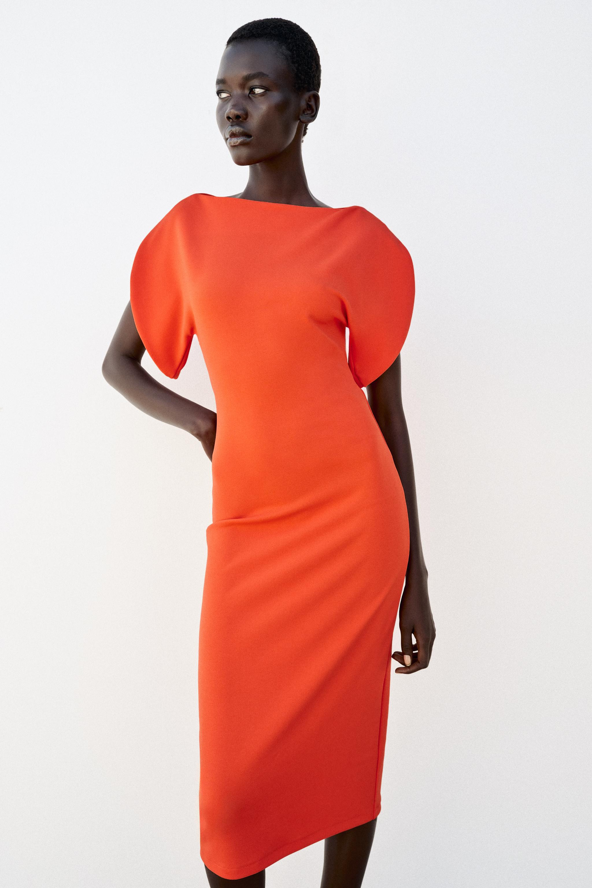 Boat neck dress with short sleeves. Straight neckline and asymmetrical short sleeves. Straight he... | Zara US