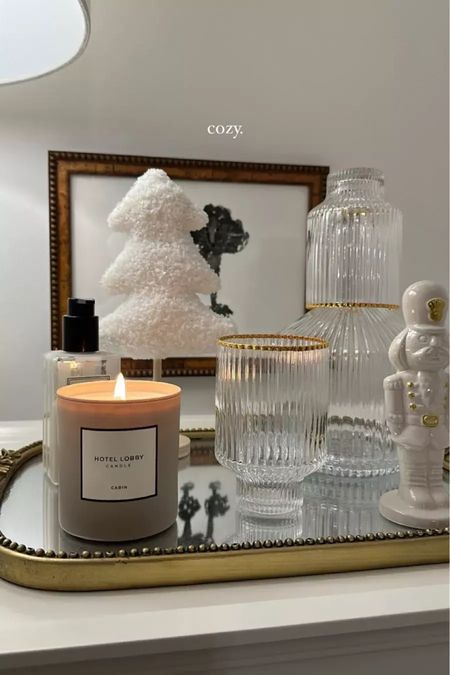 Cozy bedside table: hotel lobby cabin candle amazon glass water carafe anthropologie poodle wall art anthropologie primrose tray. You can even change out a piece of decor or two based off the season or holiday for an even more personalized touch! 

#LTKSeasonal #LTKfindsunder100 #LTKhome