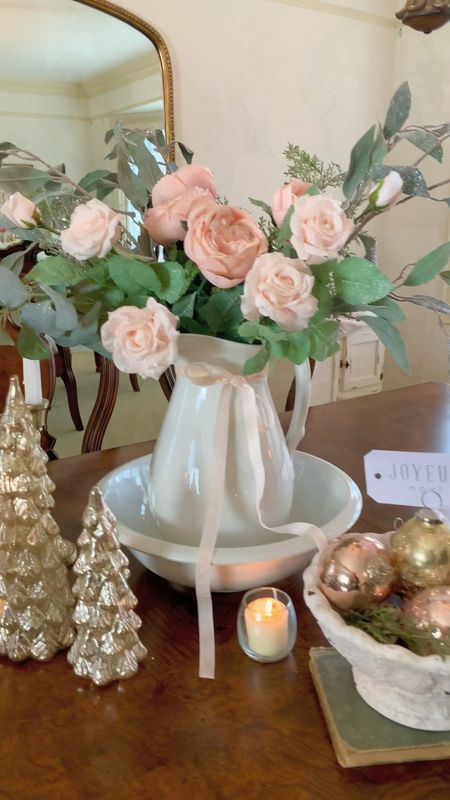 Create a vintage inspired Christmas centerpiece with rustic and romantic vibes!

Here I used an antique ironstone pitcher as a vase and curated mercury glass trees and ornaments to accent. Vintage inspired candle holders add an another layer of detail. 

#LTKSeasonal #LTKhome