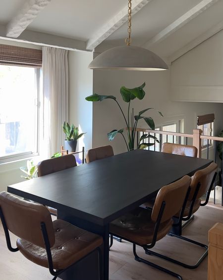 Split Level Home Dining Room. Modern design. Black dining table. Leather dining chairs. Large pendant light. Expandable dining table.

#LTKhome