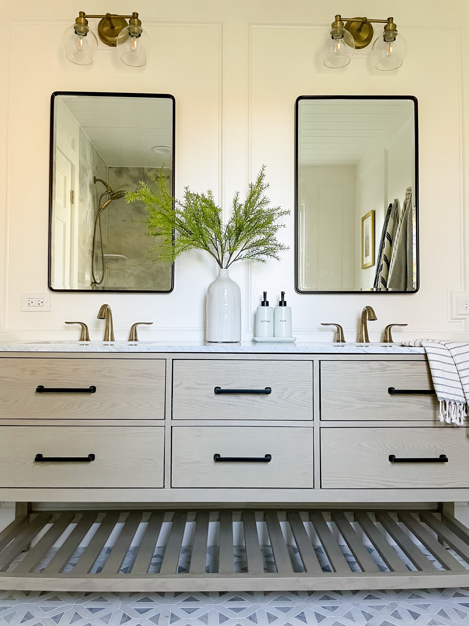 Bathroom home decor. Neutral home. Recessed medicine cabinets. Soap and lotion dispensers. Bathroom faucet. Drawer handle. Hardware. Marble tile. Vanity light. Bathroom light. Turkish towel  

#LTKFind #LTKhome