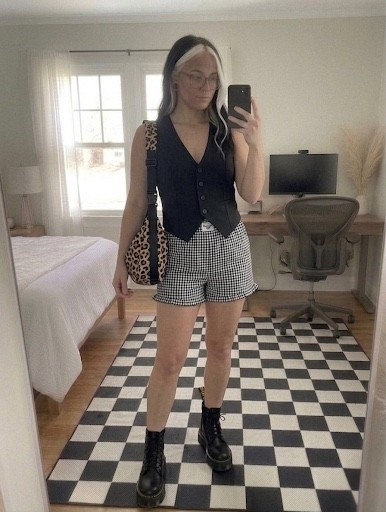 Obsessed with this edgy-meets-preppy look! I’m pairing a structured black tailored vest with high-waisted gingham shorts for the perfect seasonal transition. To keep the vibe grounded, I added my go-to platform combat boots and a pop of leopard print.

This outfit is perfect for a weekend coffee run or a casual city stroll.

#LTKootd #LTKSeasonal #LTKMidsize