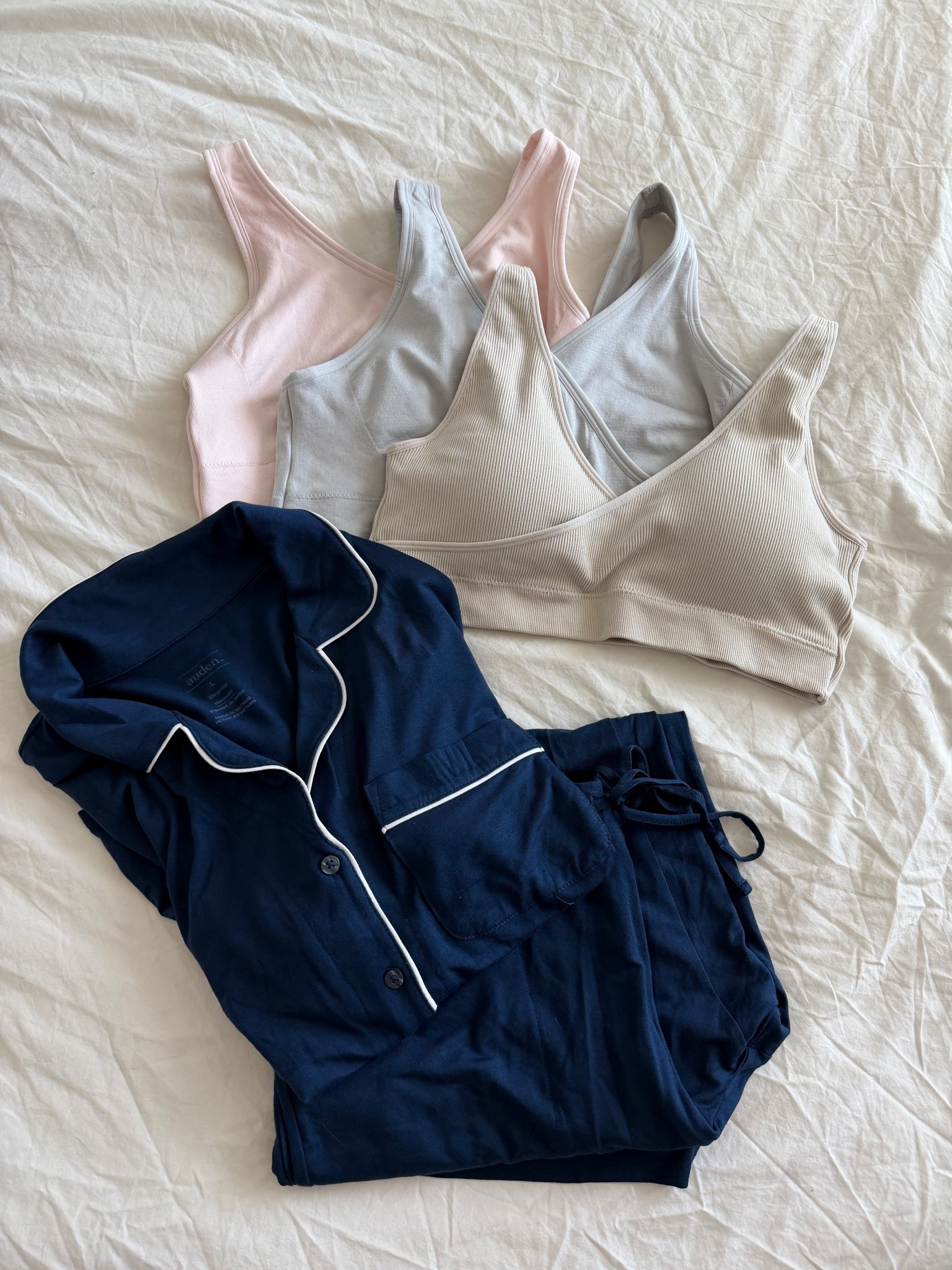 Postpartum finds from target! Got a few crossover bras for nursing and lounging (and maybe sleeping) and this pajama set. I’ll admit I didn’t realize the pajama were cropped length in the pants so I’ll be returning them, but linking them here for anyone looking for that style 

#LTKmomlife #LTKFindsUnder50 #LTKBump