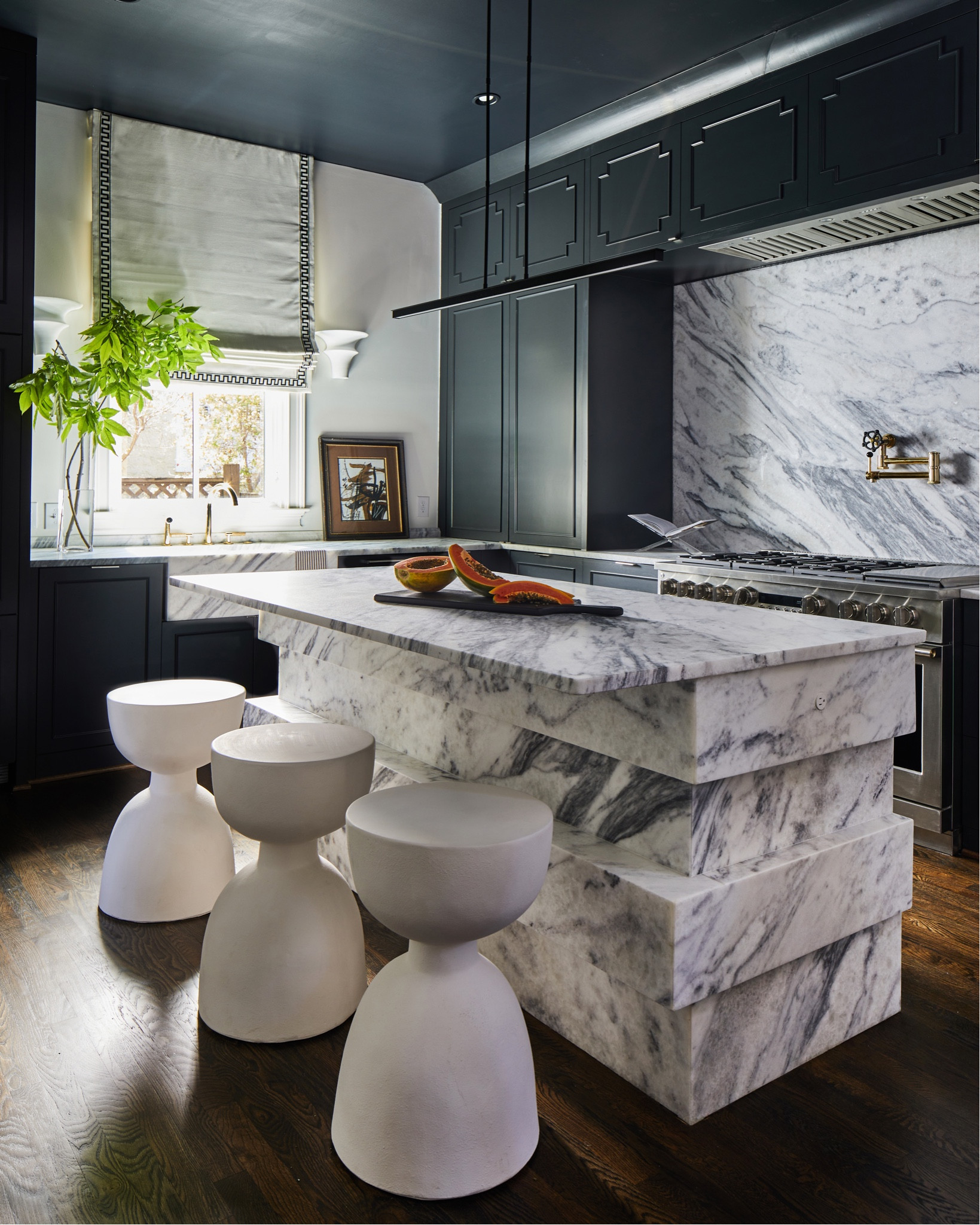 Though we adore bright and airy kitchens, there's something truly captivating about the allure of dark and moody spaces. 😍 Our hearts are captured by the dramatic contrast created when luxurious marble meets sleek, dark cabinetry. Dive into the depths of elegance with this signature look. These stools are on sale!

#LTKsalealert #LTKhome