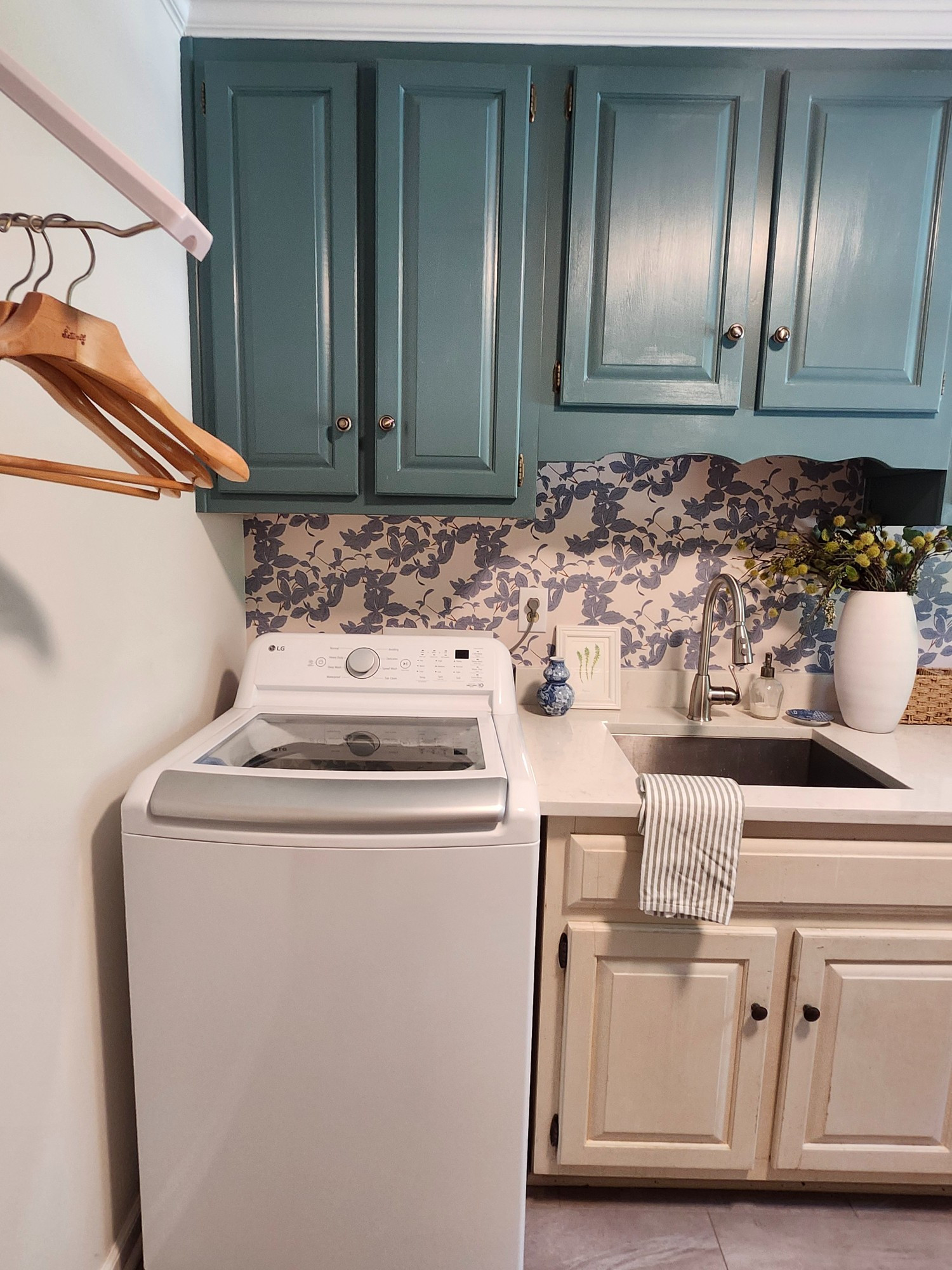 Laundry room style. Botanical wallpaper. Peel and stick wallpaper. Temporary wallpaper. Removable wallpaper. Hanger rack. Ceramic vase. Blue and white dish. Catchall. Home decor

#LTKSeasonal #LTKSaleAlert #LTKHome