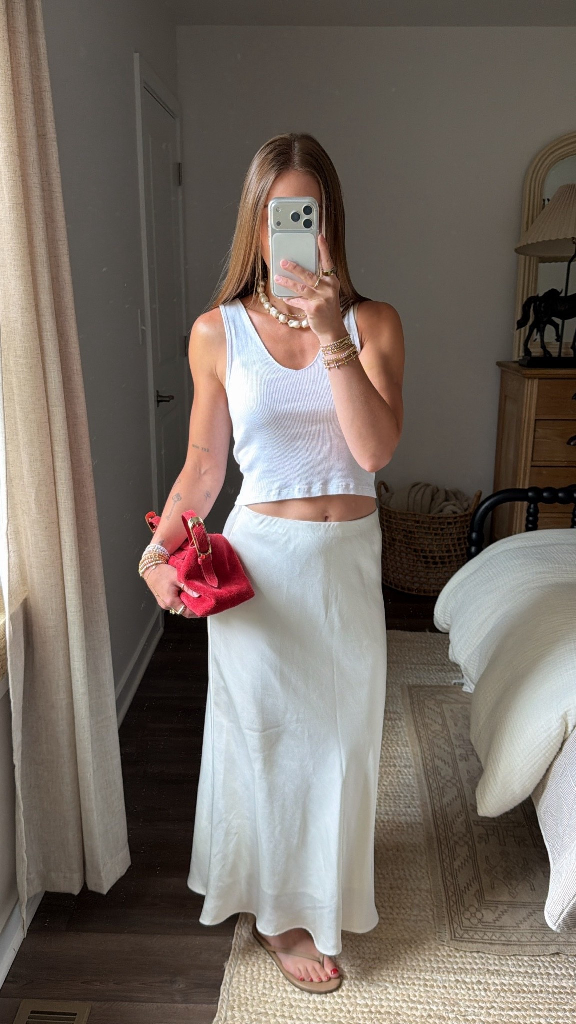 7/22/26 Casual Summer Outfit of the Day

A simple summer outfit I’ve been reaching for on repeat lately. 🤍 Paired a classic white tank with a satin midi skirt, my favorite TKEES flip-flops, red J.Crew suede bag, Amazon earrings, and Crap Eyewear sunglasses for a fun pop of color. My skirt is from Abercrombie from last year, so I’ll link the exact piece if available or a similar option. Everything I can link is linked here ✨

#LTKootd #LTKgrwm #LTKSeasonal