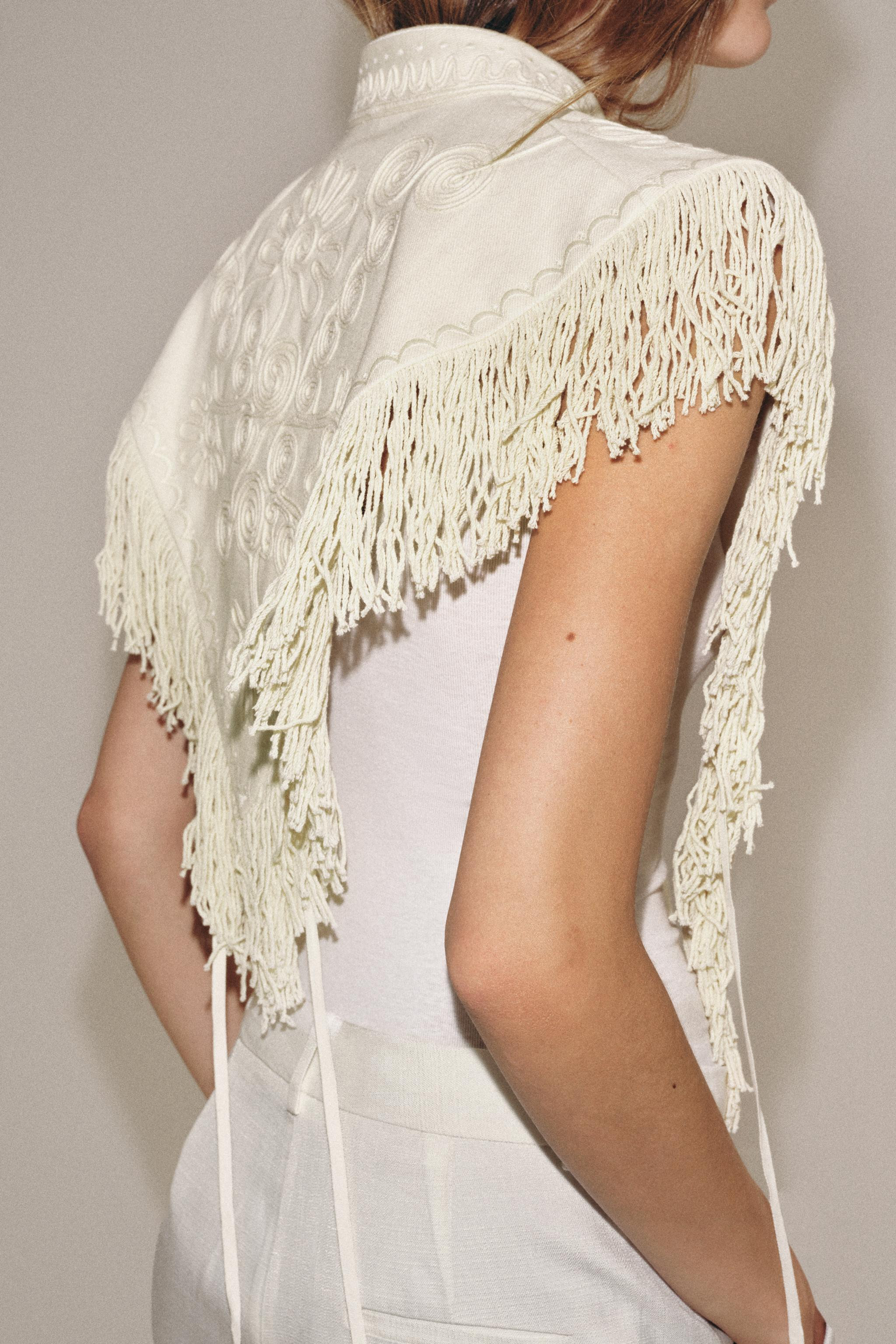ZARA WOMAN COLLECTIONRound neck vest with main fabric made of cotton yarn. Tonal embroidery and f... | Zara US