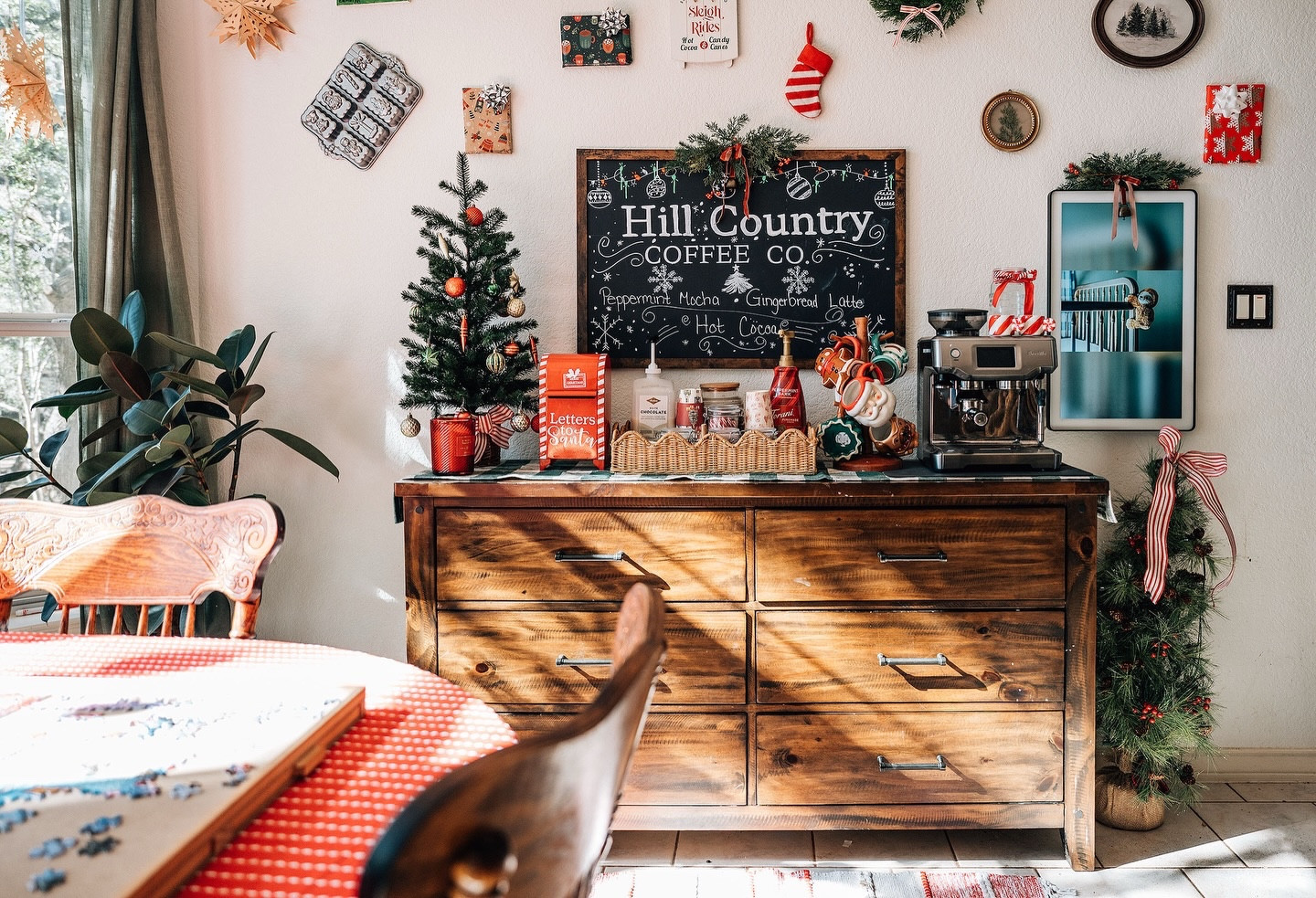 💌 A love note to my coffee bar…

For years, my espresso machine lived on the counter.
I’d swap out mugs with the seasons, add little festive touches,
and quietly dream of having a real coffee bar…
a place to decorate, linger, and truly enjoy.
It always felt like a maybe someday dream.

A few months ago, while reorganizing the house,
I realized my dresser didn’t quite belong anymore.
But it was the perfect height for a coffee bar,
and suddenly, the idea felt possible.

As Christmas approached, I started imagining what this space could become.

A cozy corner to sip coffee slowly,
work on a puzzle together,
and linger a little longer.

When we lived in NYC, we used to visit a small café at Christmas time, ornaments hanging from the ceiling, lights everywhere.
The kids loved it.
I carried that vision with me into this space this season.

Now this little corner holds hot cocoa mornings,
spilled sprinkles, sticky fingers,
and our pup basking in the sun.

It’s more than a coffee bar.
It’s a small, cozy piece of home 🤍

#cozychristmas
#cozyhomevibes 
#christmasmagic
#christmas 
#christmasseason