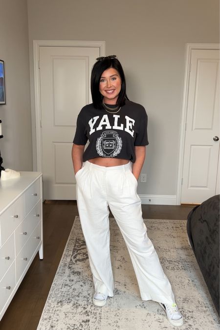 A more casual way to style linen pants for spring and summer- the cropped oversized graphic tee is my fav. Any graphic tee will work, but white lettering matches best. Add some sneakers and gold jewelry. This is a cute travel outfit as well  

#LTKshoecrush #LTKtravel #LTKstyletip