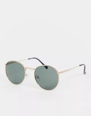ASOS DESIGN round sunglasses in gold with nose bridge detail | ASOS (Global)