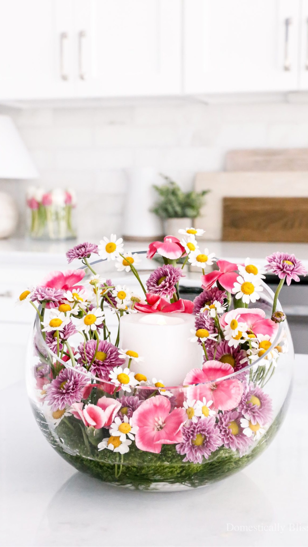 This DIY Flower Garden Candle Vase is filled with bright pink and purple flowers with a flameless candle in the center.

See details:
https://domesticallyblissful.com/diy-flower-garden-candle-vase/



#LTKWedding #LTKHome #LTKSeasonal