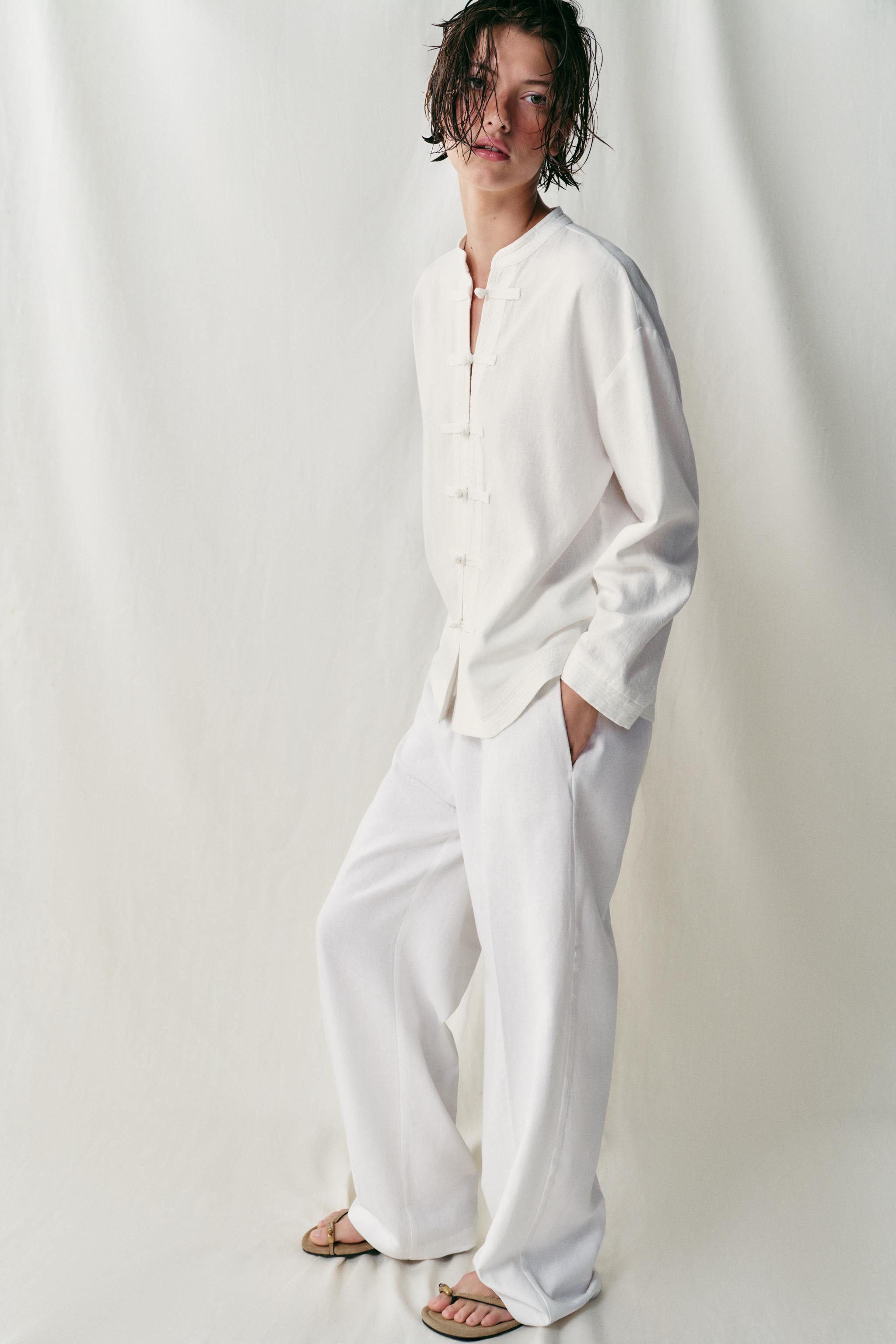 Oversized shirt made of linen. Round neckline and long sleeves. Front button closure. | Zara US