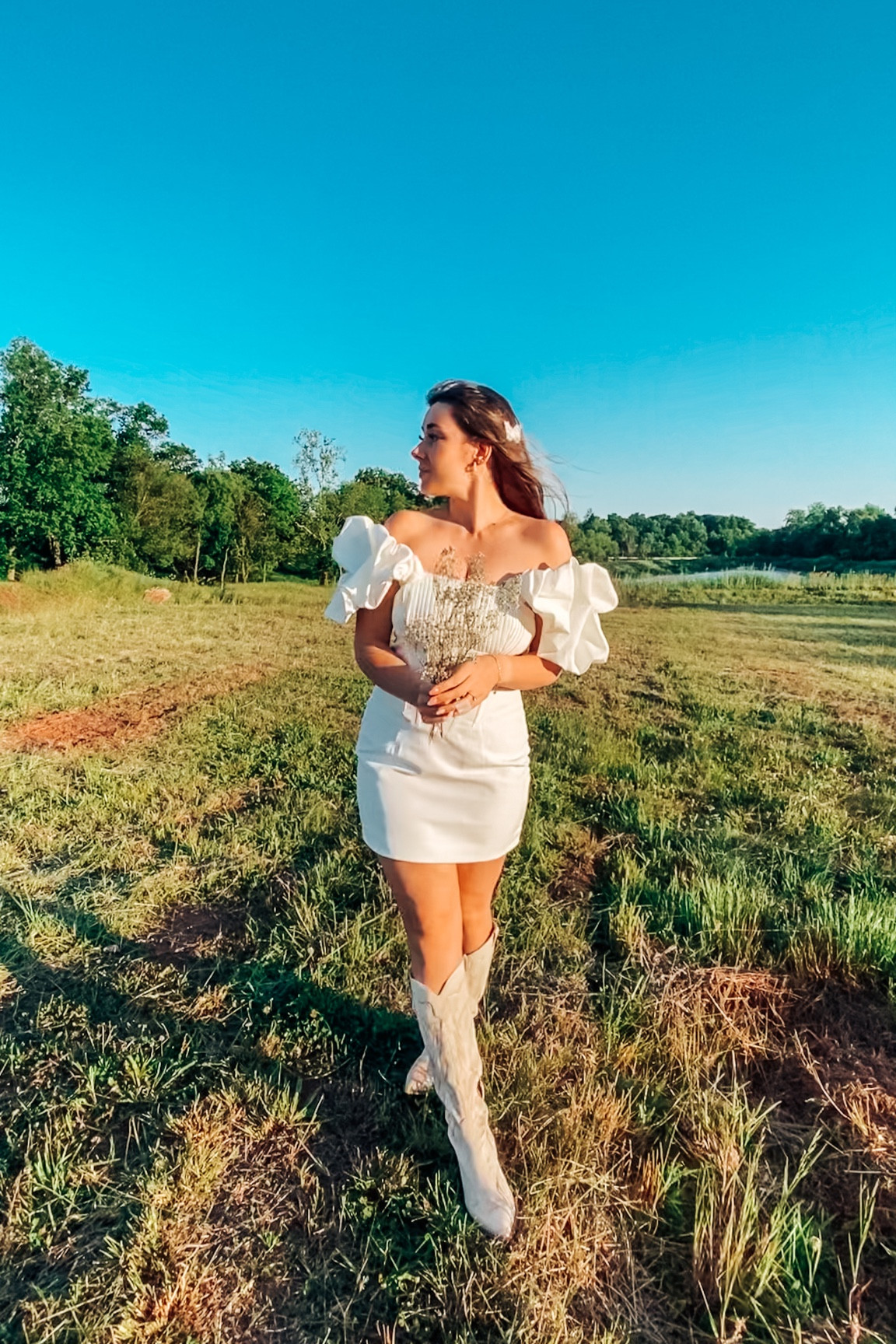 Little White Dress
Bridal look
Dolce vita
Cowboy boots
White dresses
Bridal outfits
Puff sleeves 

Wearing size 10 boots TTS

#LTKsalealert #LTKFind #LTKwedding
