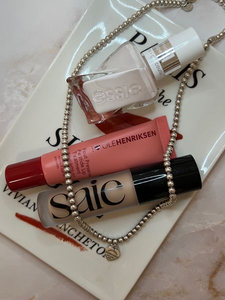 My april favorites. The saie slip tint concealer is a new holy grail— so creamy, buildable and hydrating. Great for dark circles. Cannot get enough of the ole henriksen pout preserve— gives the juiciest, hydrated looking lips. Also loving essie gel couture polish and my beaded tiffany heart necklace 

#LTKfindsunder100 #LTKbeauty #LTKstyletip