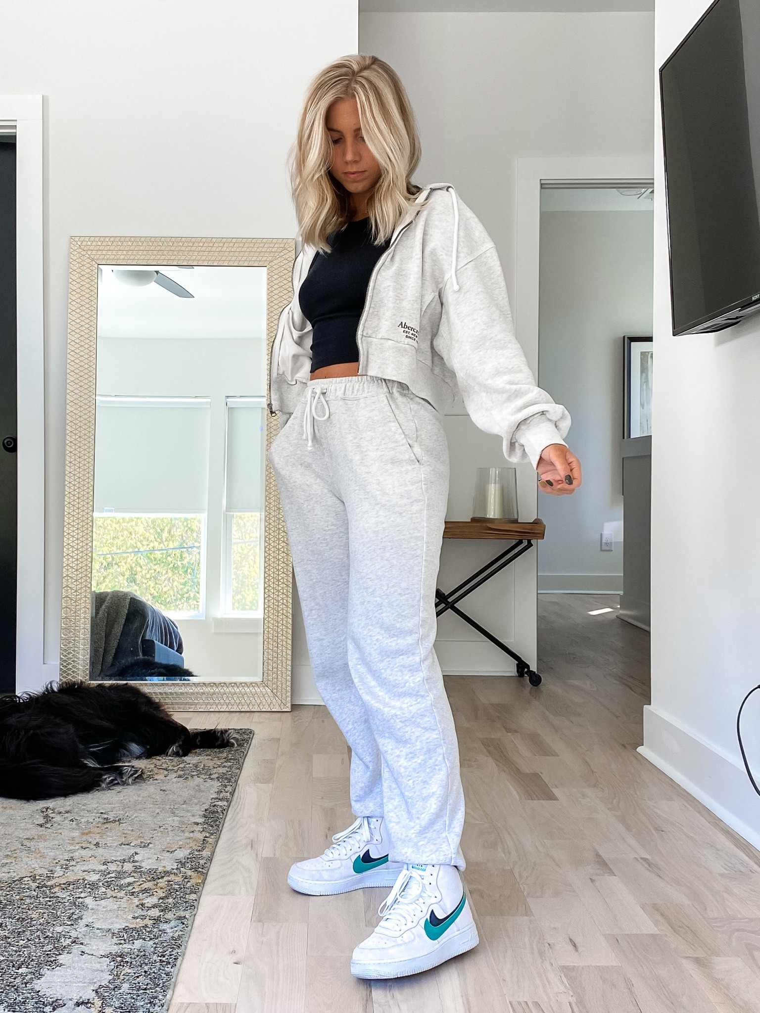 Grey joggers and cropped zip up jacket with black ribbed tank and Nike airforce one’s 

#LTKstyletip #LTKshoecrush #LTKtravel