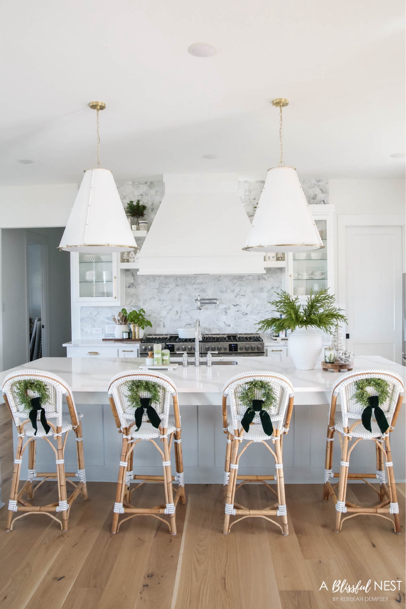 My Christmas kitchen this year includes mini juniper wreaths with green velvet ribbon to the backs of my Serena & Lily barstools. I also used the viral Norfolk pine stems in a large white vase and my favorite Frasier fir candle. 

Christmas home tour, holiday home tour, coastal decor, coastal style, coastal grandmother, Amazon finds, Amazon decor. 

#LTKHome #LTKSeasonal #LTKHoliday