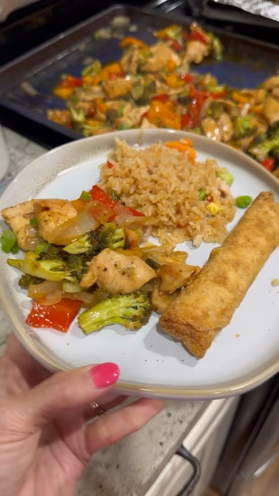 Y’ALL… 🤤 this one was a HIT at our house!

I needed a super easy dinner for a busy night of cheer carpool, so I literally put my husband in charge of cooking AND filming.

This Orange Chicken & Veggies Sheet Pan Meal is so simple, packed with flavor, and the best part is everything cooks on ONE pan. Perfect for those crazy weeknights when everyone is running in different directions.

Save this one because I promise your family will ask for it again!

Ingredients:
• 3 boneless skinless chicken breasts, cut into bite-sized pieces
• 1 onion, chopped
• 1 bell pepper, chopped
• 1 head broccoli, chopped
• Olive oil
• Salt & pepper
• Kinder’s Buttery Steakhouse Seasoning
• Paprika
• Panda Express Orange Sauce
• Green onions, chopped (for topping)

Directions:
1️⃣ Preheat oven to 400°F.

2️⃣ Chop your veggies (onion, bell pepper, broccoli) and place them in a large bowl.

3️⃣ Drizzle with olive oil and season with salt, pepper, and Kinder’s Buttery Steakhouse Seasoning. Toss to coat.

4️⃣ Spread the veggies onto a sheet pan and push them to one side.

5️⃣ In a separate bowl, add the bite-sized chicken pieces. Drizzle with olive oil and season with paprika, salt, pepper, and the same steakhouse seasoning. Toss to coat.

6️⃣ Add the chicken to the empty side of the sheet pan and drizzle orange sauce over the top.

7️⃣ Bake for about 25 minutes, or until the chicken is fully cooked.

8️⃣ Drizzle a little extra orange sauce on top and sprinkle with chopped green onions.

We served ours with egg rolls and fried rice, and the whole family cleaned their plates!

🩷 Save this recipe for later and tell me if your family loves it as much as ours!

#easyweeknightdinner #sheetpandinner #easyfamilymeals #dinnerideas #easyrecipes