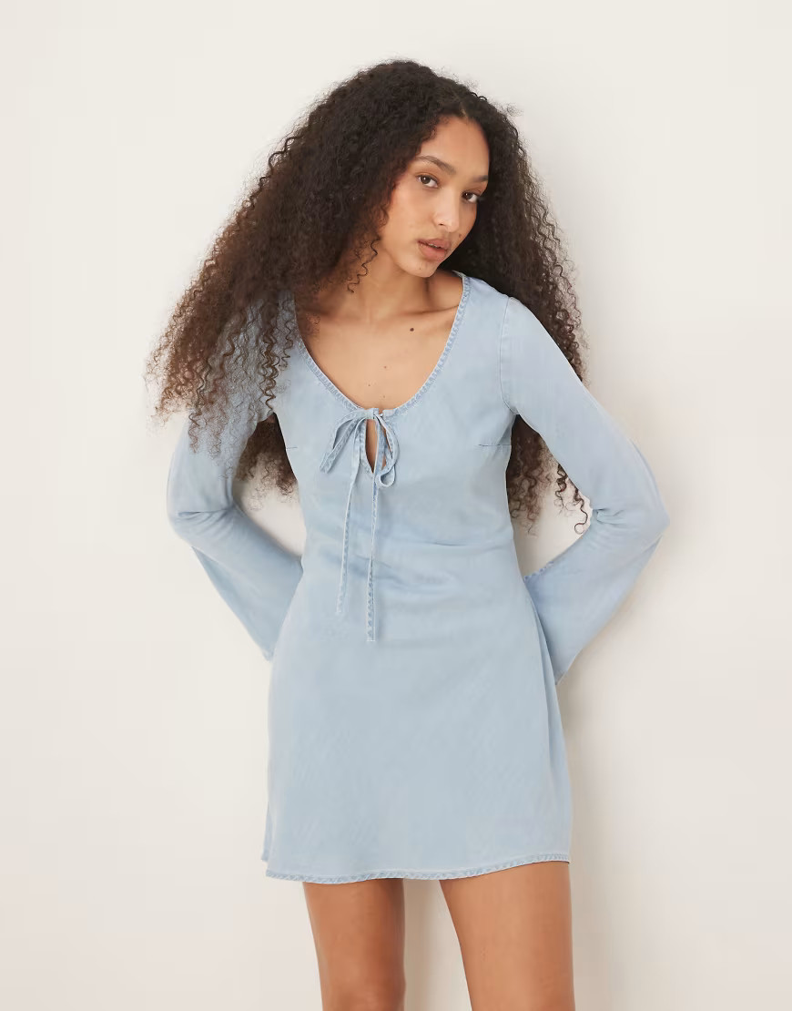 ASOS DESIGN soft denim mini dress with bow front detail in light blue | ASOS (Global)
