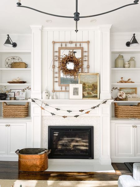 A little bit of spook on the mantel. This metal bat garland is sold out everywhere. I tried friends! I linked another one below as well as some pretty vintage paintings for that fall feel! 

#LTKhome #LTKHalloween #LTKHoliday