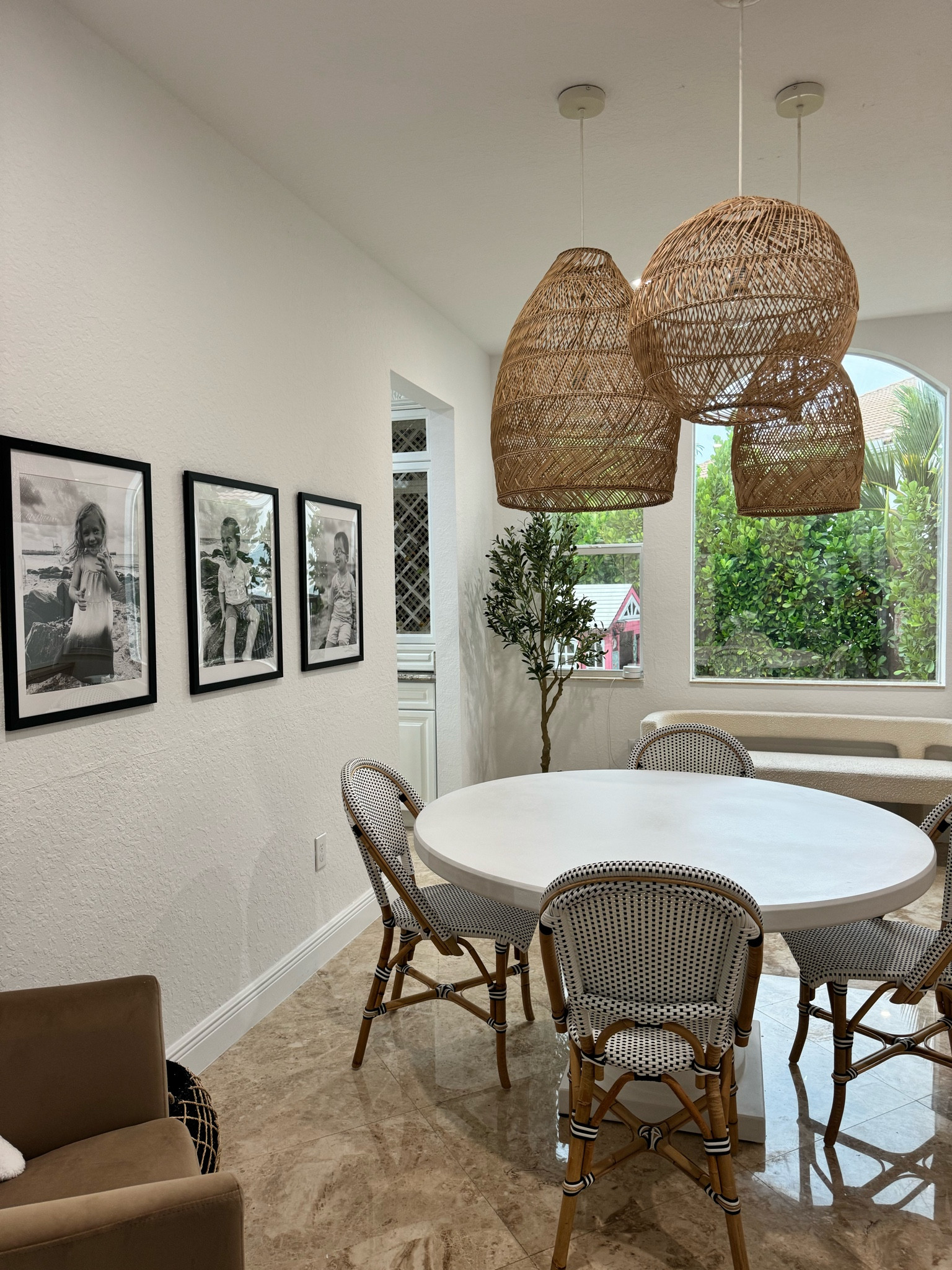 Dining room turned study. Kid friendly dining chairs and rattan pendants make this room so inviting! 

#LTKHome #LTKFamily #LTKSeasonal