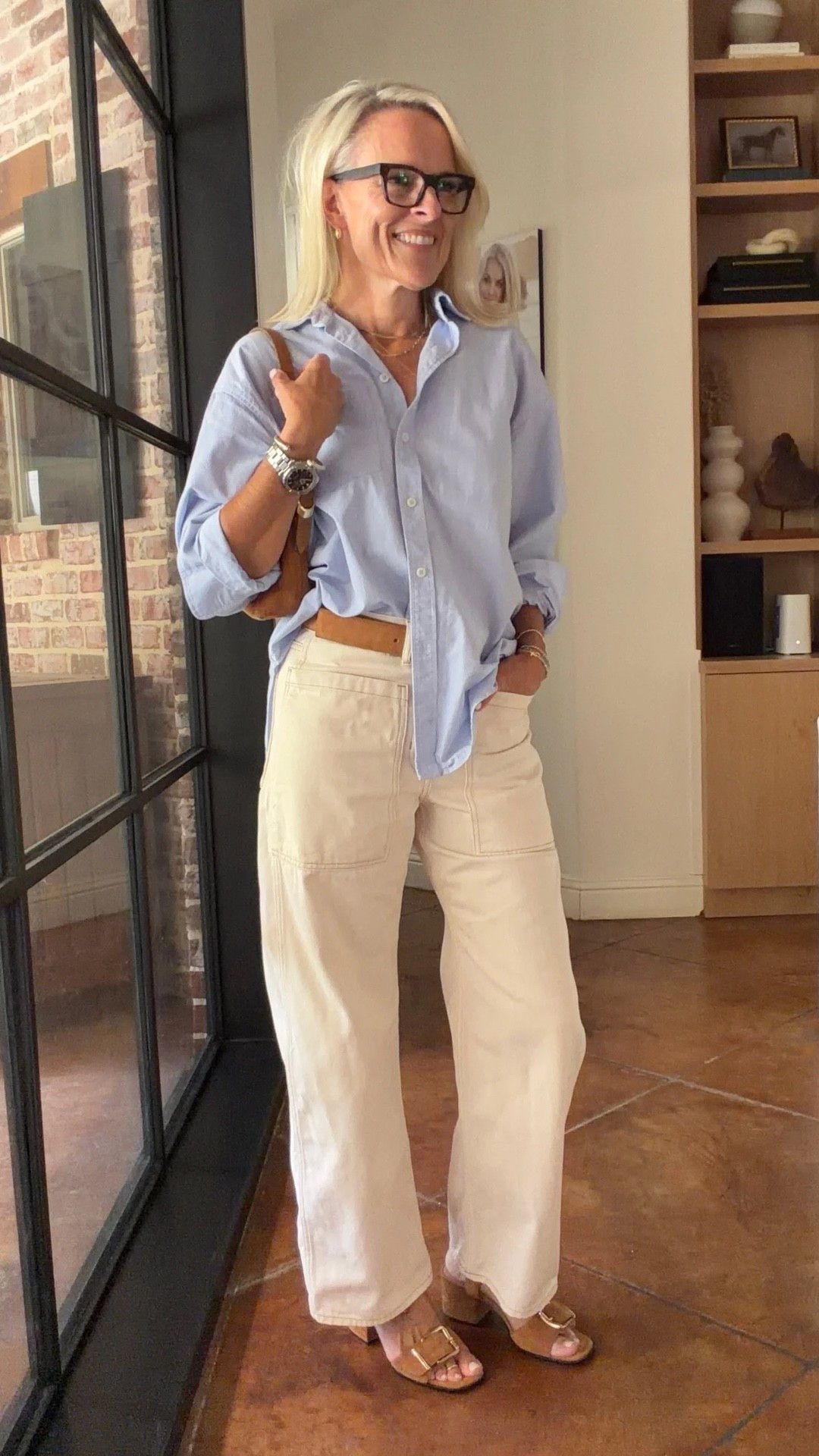 A light blue button-down and cream pants is one of those combinations I never get tired of. 🤍 I love the relaxed feel of this shirt with the wide-leg pants, and the brown accessories add just enough contrast to keep the look polished.

This is an easy outfit for everyday wear, lunch, errands, or travel, and both pieces can be styled so many different ways. Wear the shirt with jeans or shorts, or pair these pants with a simple tee, sweater, or tank.

#LTKootd #LTKOver40 #LTKTravel
