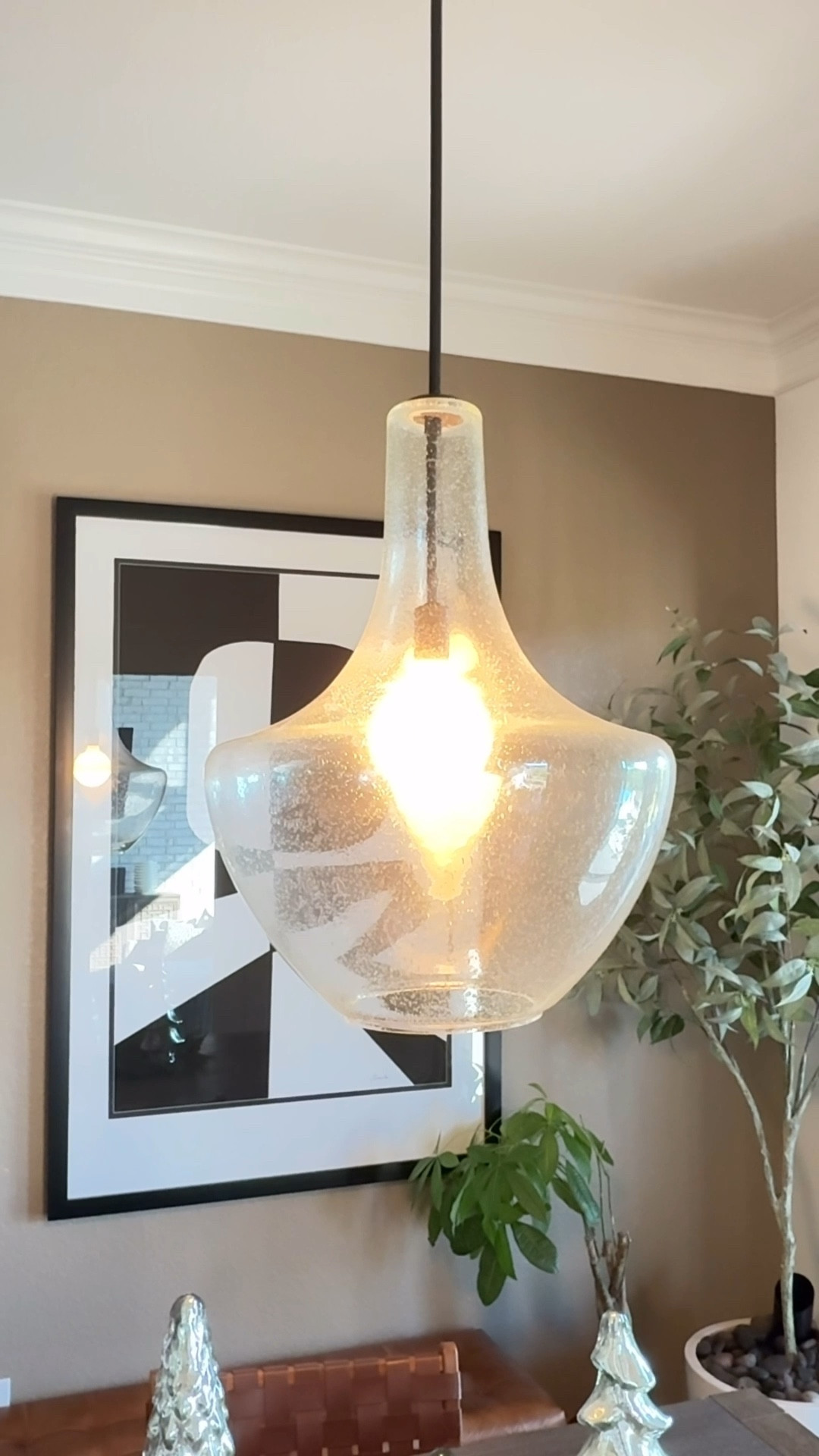 Clear glass pendant light for a bright and simple kitchen update
This one has that pitted glass detail that adds texture without feeling heavy, and the wide rounded shape gives off such a soft, warm glow over a table. It feels modern but still cozy, and the dark bronze hardware blends right in with so many styles. The glass looks beautiful in natural light and adds an easy polished finish to the room.

#LTKHome