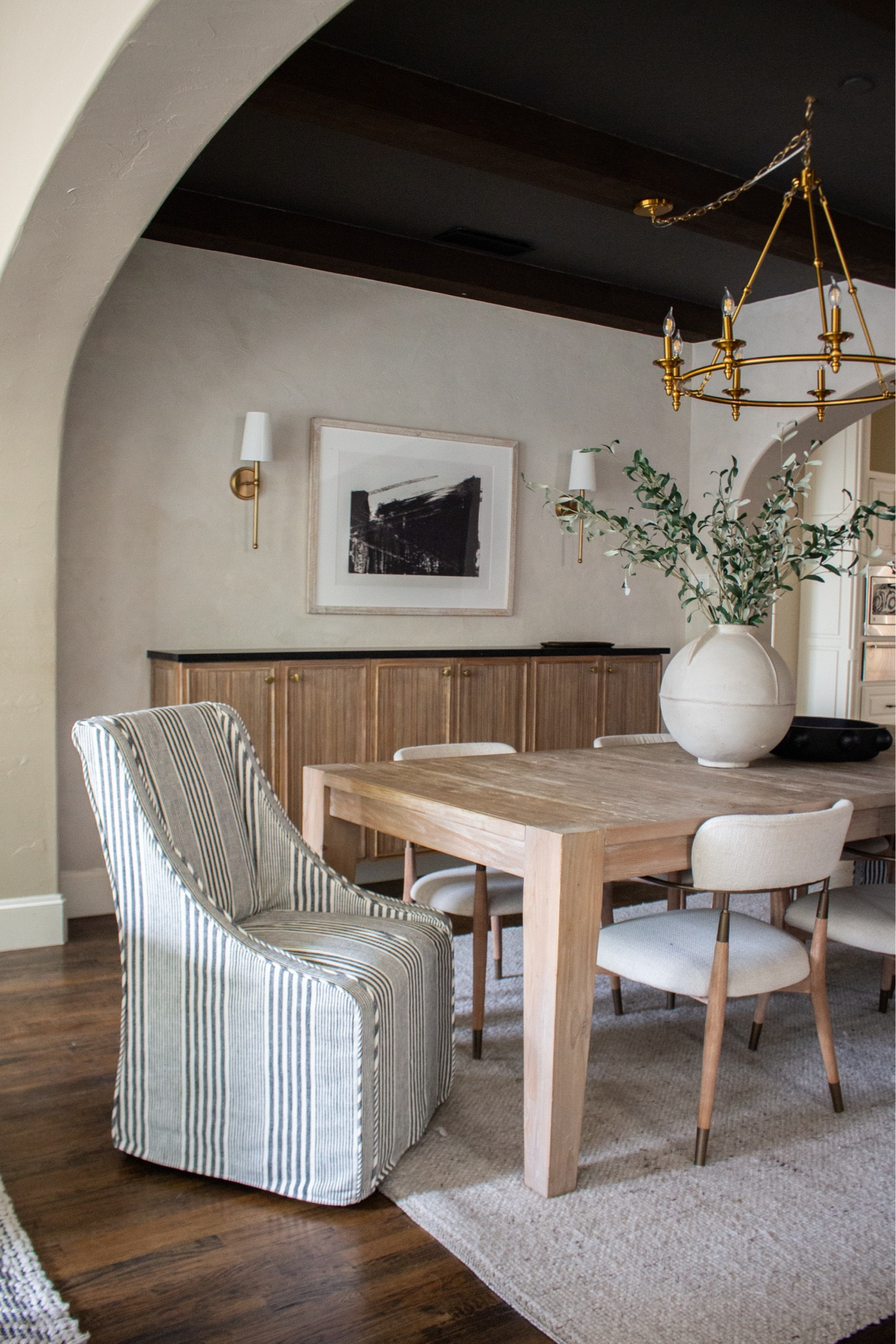 The key to a timeless dining room? Texture. Wood grain, woven rug, soft upholstery, and warm metal lighting layered together. Shop similar pieces that give this cozy, collected feel.

cozy dining room, woven area rug, upholstered dining chairs, wood sideboard cabinet, brass wall sconce, warm neutral home, rustic modern decor


#LTKSeasonal #LTKHome