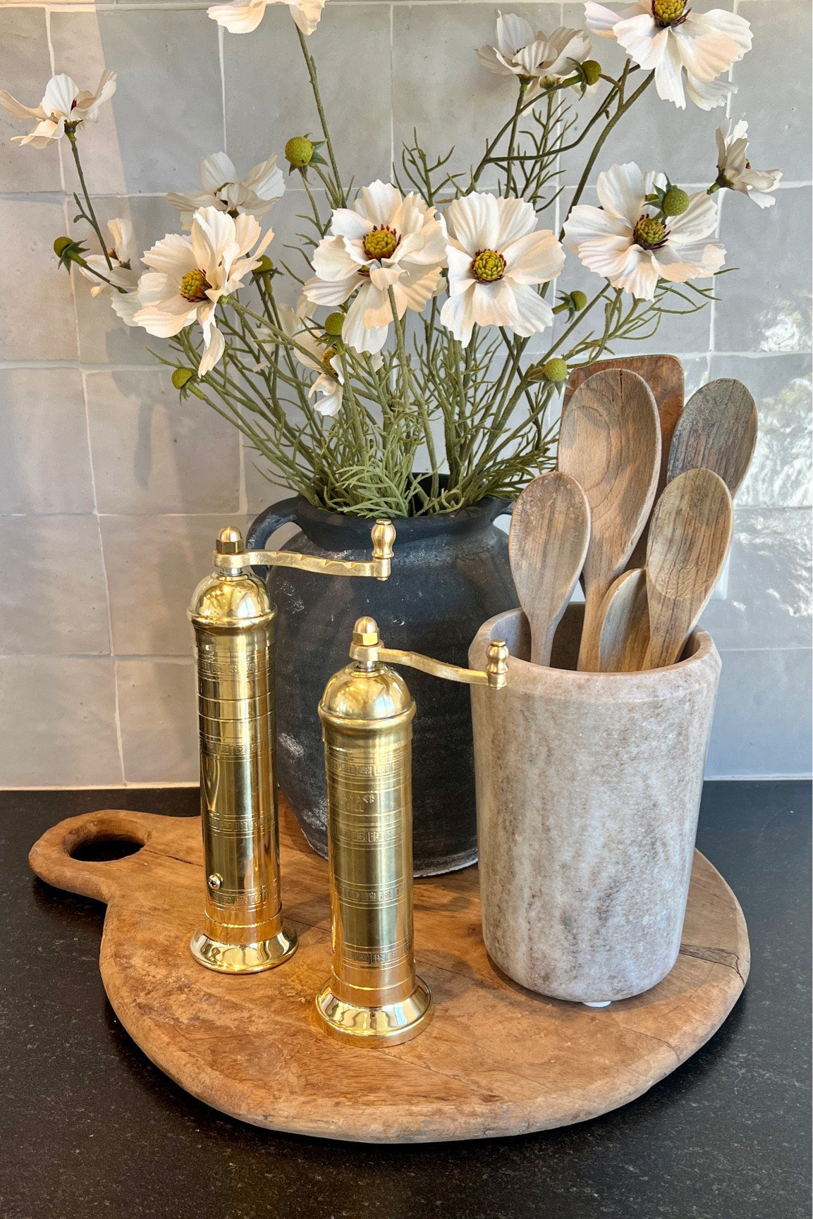 Kitchen accents next to the stove

#saltcellar
#kitchenstyle
#kitchendesign
#kitchendecor
#kitchenaccessories
#kitchendecor
#saltandpepper
#saltmill
#peppermill
#utensilholder
#fauxflowers

#LTKHome