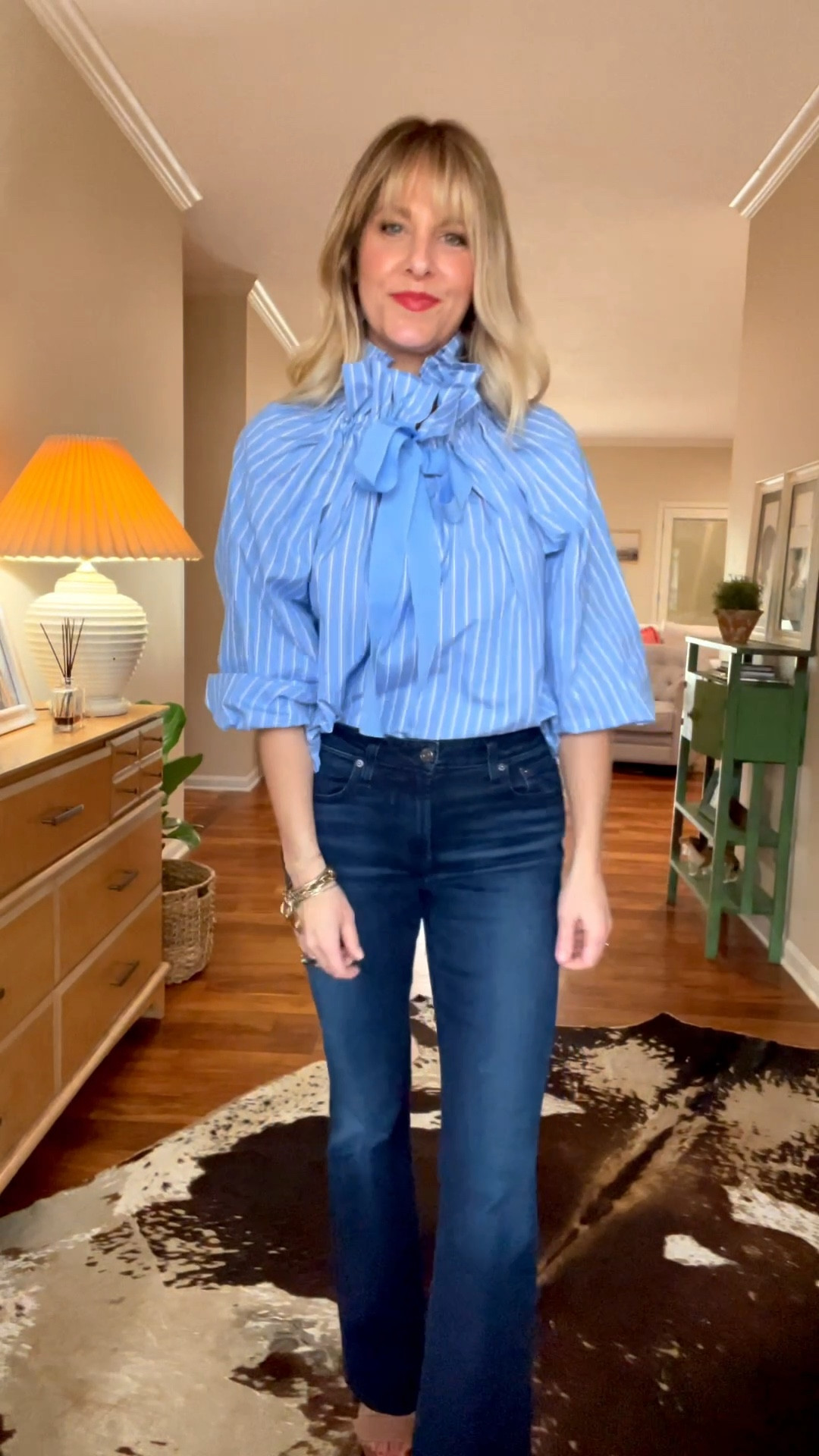 I couldn’t put this top in my cart fast enough! Y’all! The ruffle collar is everything this spring! This comes in this blue color and a mint green, and you will not believe the price! I’m wearing my true size. 

#LTKootd #LTKOver40