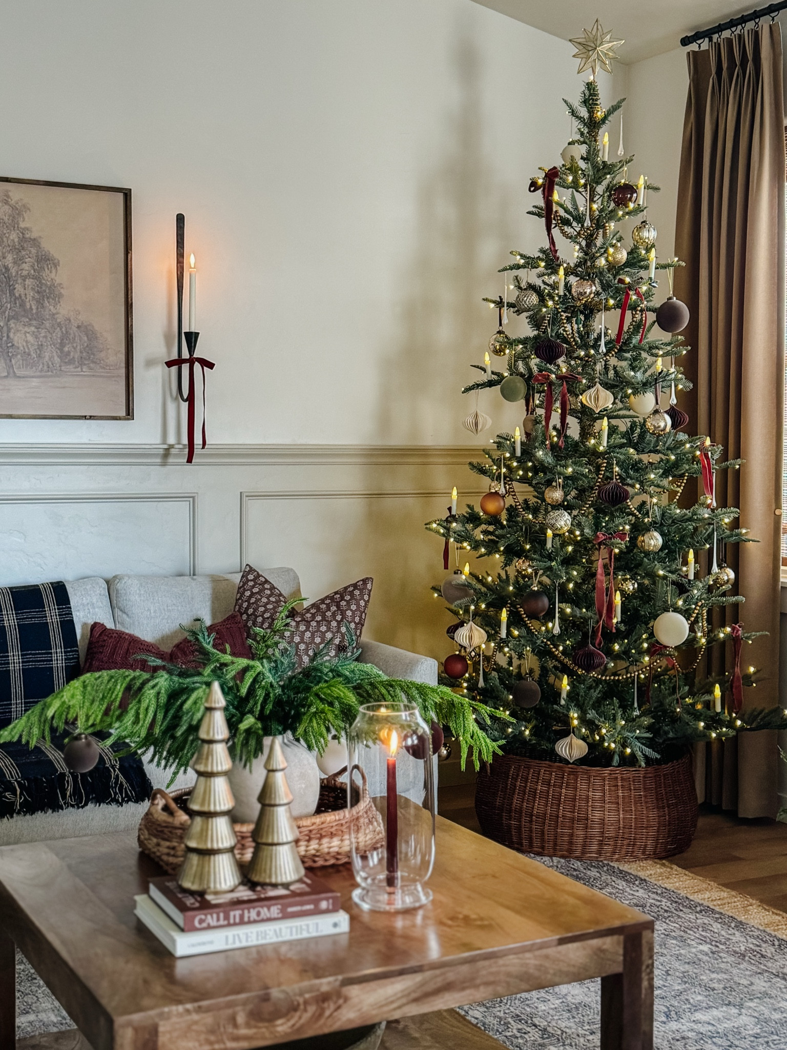 Christmas, living room, holiday, home decor, pre-lit Christmas tree, Living room inspo, custom curtains, pinch pleat curtains, floor to ceiling curtains, neutral sofa, beige sofa, west elm penn chair, green accent chair, vintage pillows, Turkish pillows, boucle pillow, shady lady tree, faux tree, greenery, Walmart floor lamp, woven table tray, square wooden coffee table, wall sconce, tapered candle holder, citrus tree, throw pillows, floor length mirror, arch mirror, Target home decor, affordable home, black cabinet, studio McGee cabinet, round glass coffee table, target accent table, vintage inspired rug, vintage milking stool, foot stool#LTKVideo

#LTKSaleAlert #LTKGiftGuide #LTKHoliday