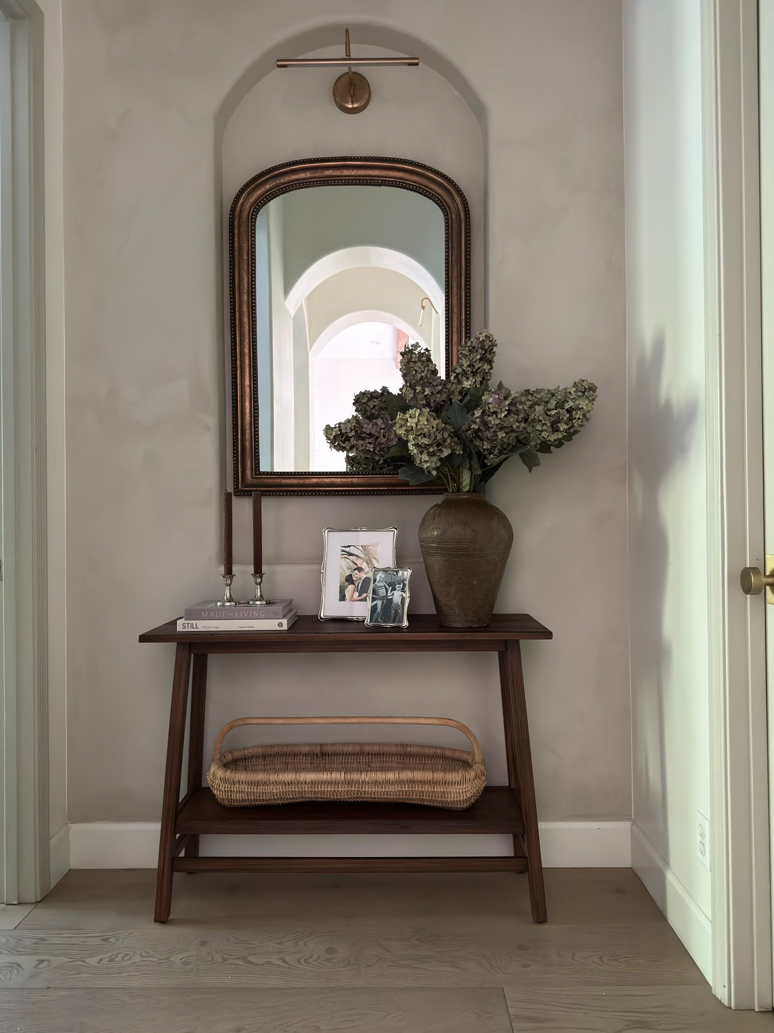 New Foyer Decor

Faux hydrangeas, silver picture frames , traditional modern home.