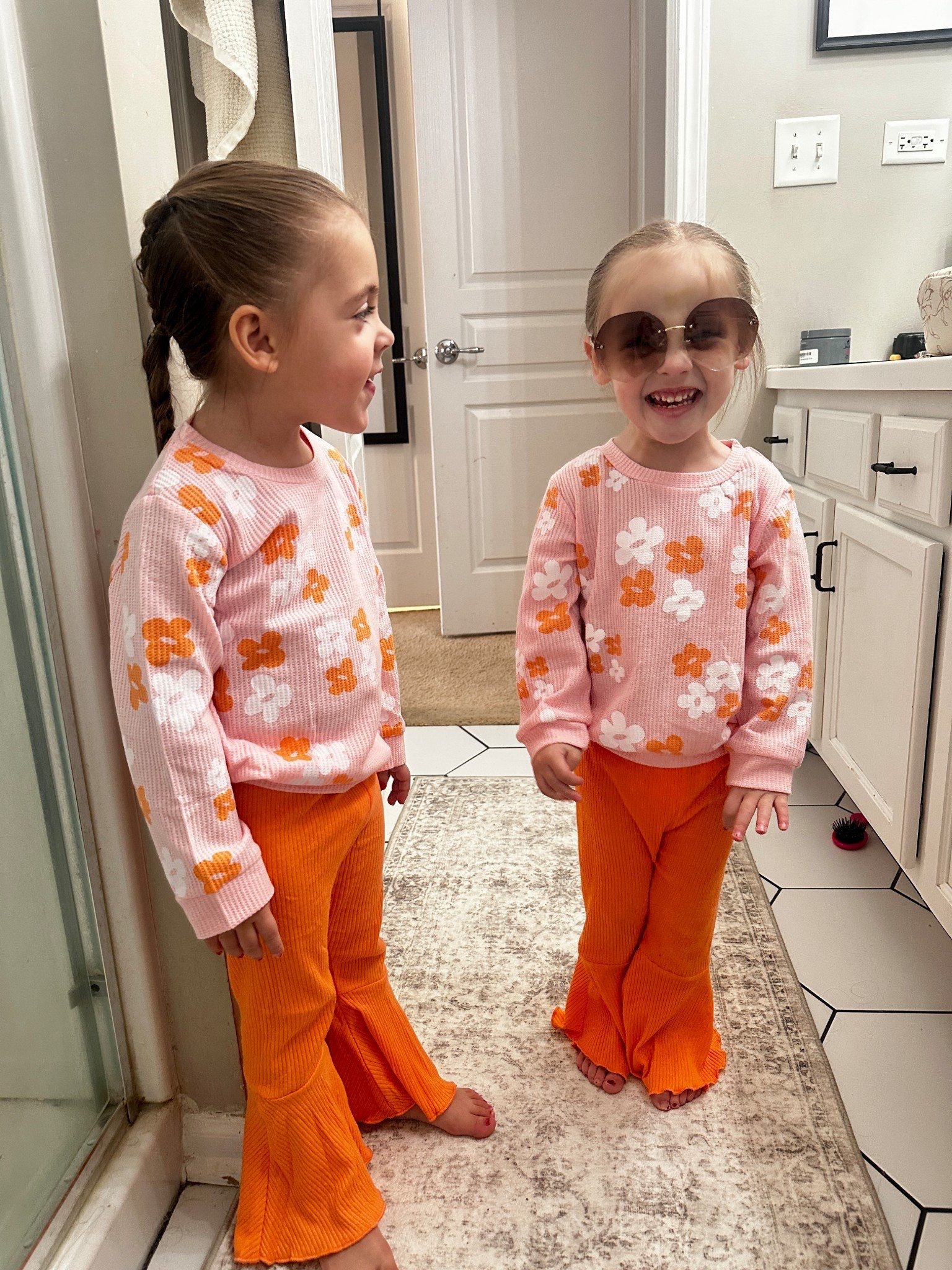 Young, Wild & THREE 🧡🌼

The girls wore matching retro floral sets for their 3rd birthday and I’m obsessed. The pink flower tops + bright orange flares were perfect for our groovy theme and so comfy for toddlers.