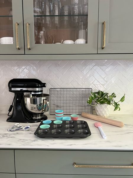 Baking essentials including a black Kitchen Aid mixer, measuring cups, silicone cupcake cases, rolling pin, silicone spatula and spoons and a cooling rack, mixing bowls

#LTKSeasonal #LTKhome #LTKeurope