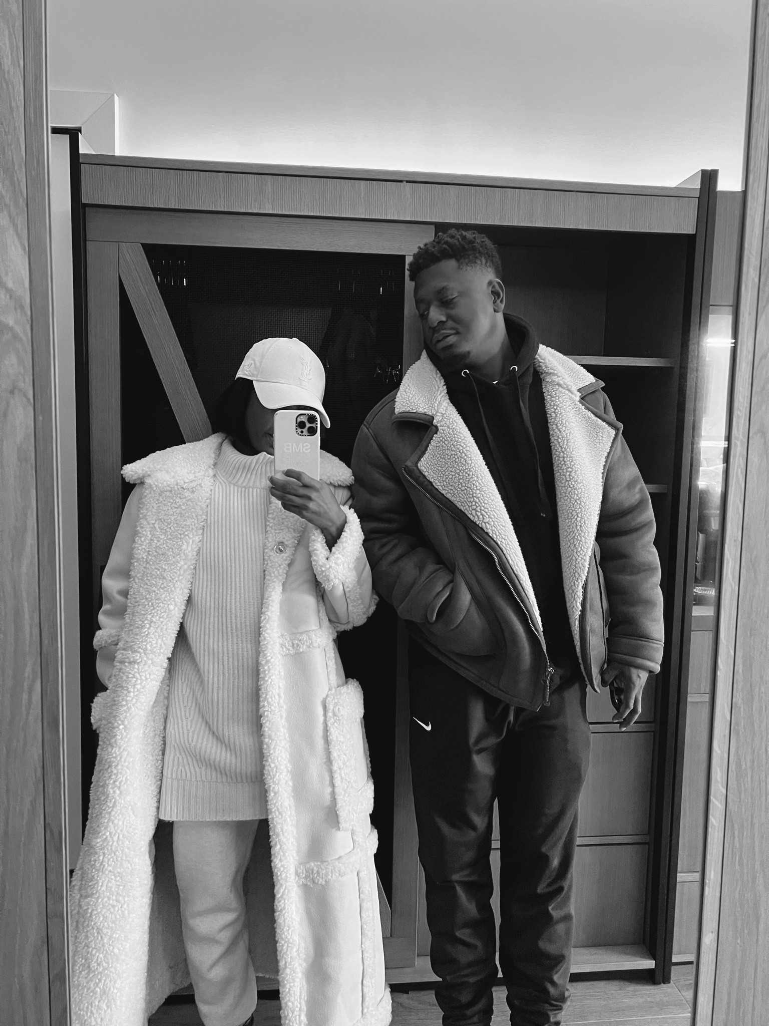 Faux shearling jackets / coats, men's Nike sweat pants and hoodie. Sleeveless turtleneck sweater and cream dad cap 

#LTKstyletip #LTKmens #LTKtravel