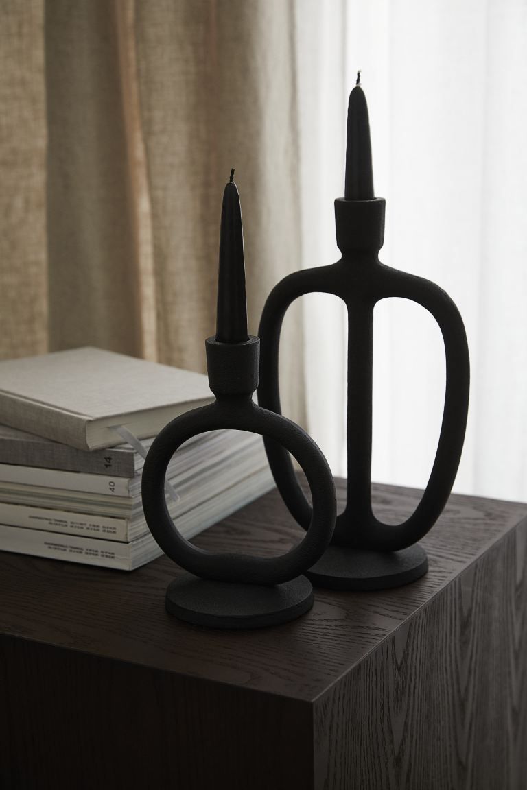 Tall, oval-shaped candlestick in matte metal with a low base. Height 9 1/2 in. Diameter at widest... | H&M (US + CA)