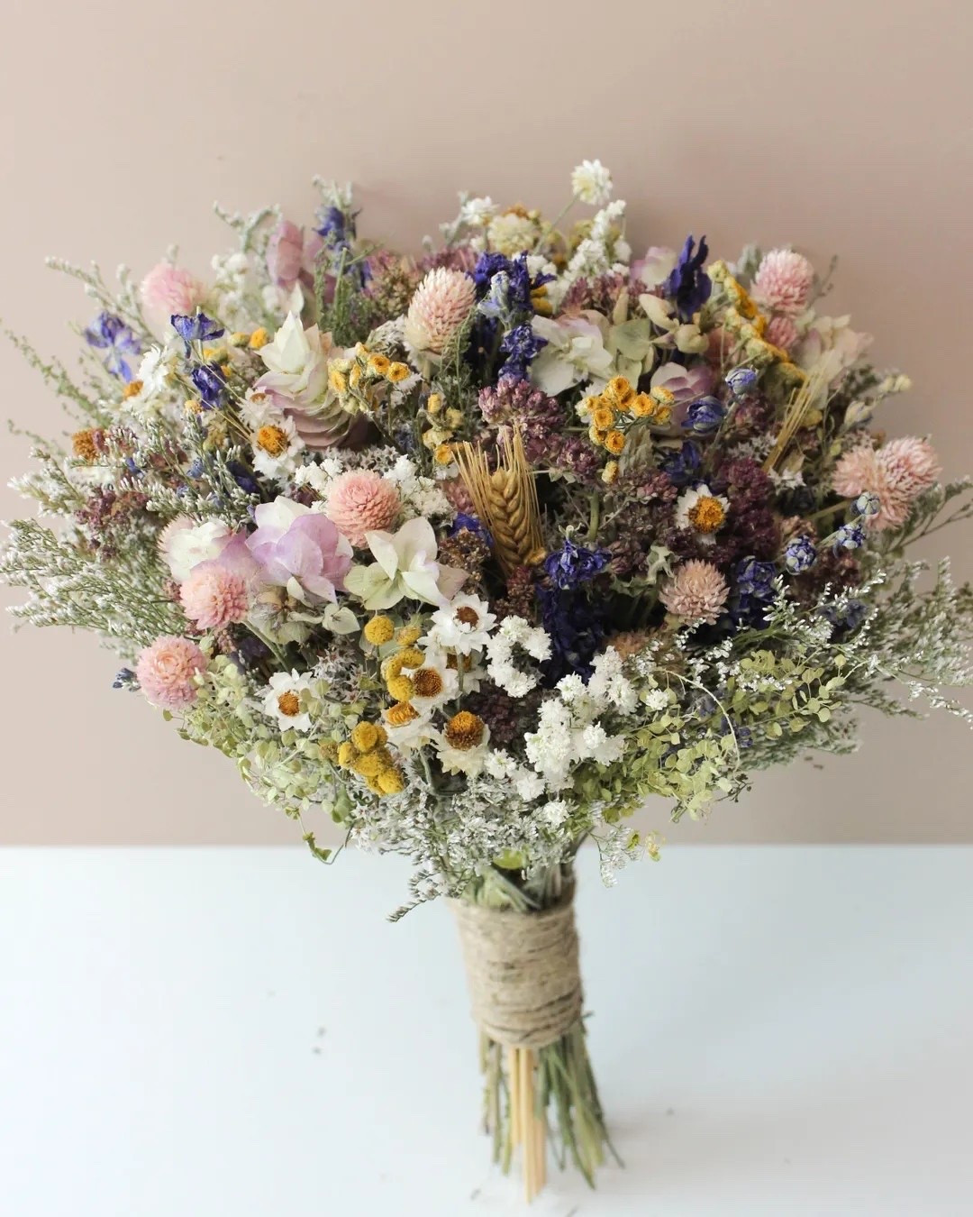 Soft, romantic, and full of natural texture — this dried flower bouquet is designed with dreamy purple tones, blush accents, bunny tails, dried daisies, baby’s breath, and wispy field grasses for an effortlessly elegant look. Perfect for weddings, bridal showers, baby showers, or styling in your home long after the celebration ends. Available in multiple sizes to fit every vision and beautifully handcrafted to feel one of a kind. #DriedFlowerBouquet #BohoWedding #BridalBouquet #WeddingInspiration #PreservedFlowers #RusticWedding #NeutralDecor #BabyShowerDecor #BridalShowerIdeas #LTKStyle

#LTKWedding #LTKHome #LTKSeasonal