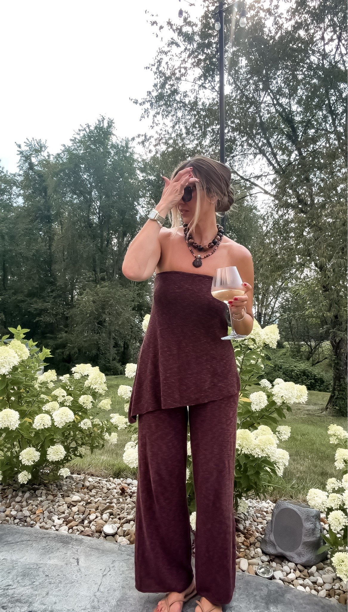 I wore this deep burgundy set for drinks outside, and the rich color felt polished without being too dressy. The strapless asymmetrical top gives the outfit shape, while the soft wide leg pants move easily and keep it comfortable enough to sit, mingle, and stay awhile.

burgundy matching set, strapless top, wide leg pants, summer evening outfit, garden party outfit, date night set, monochromatic style, comfortable two piece set, over 40 fashion, TheMomInStyle

#LTKootd #LTKOver40 #LTKTravel