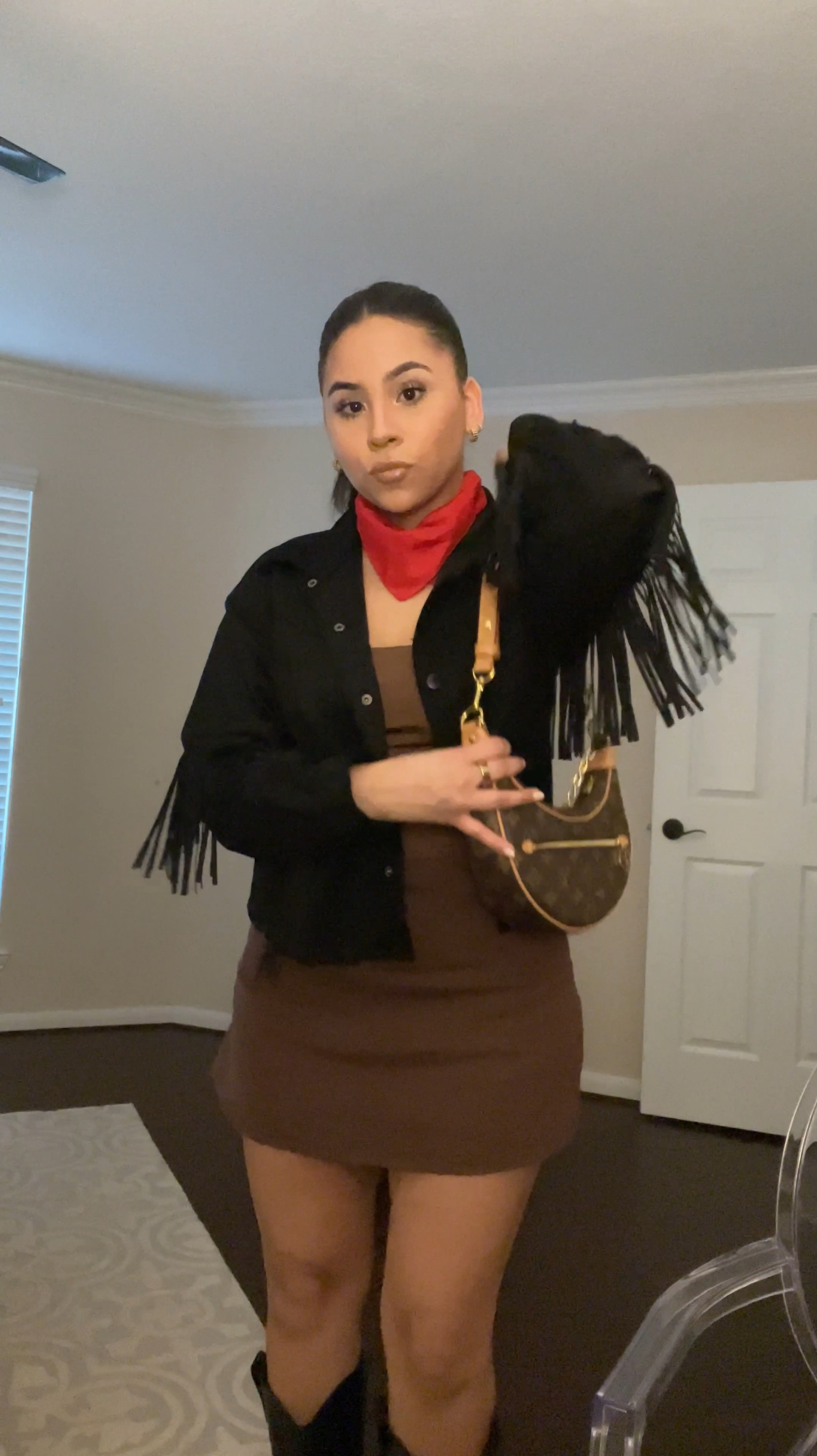 Rodeo outfit idea 
Red bandana 
Brown tank: small 
Brown linen skirt: small 
Fringe black jacket: small 
Black western heel boots: 6 
Louis Vuitton monogram loop 
L’Oréal Paris leshadow stick “twinkle rose” 
Ysl black opium 
Gold earrings 
Gold oura ring 
Houston rodeo • rodeo Houston • western outfit • country concert outfit 

#LTKStyleTip #LTKPetite #LTKSeasonal