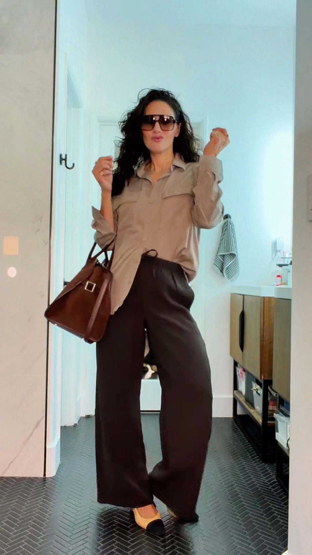 A little mix of elevated + effortless 🤎 This Aritzia button-up paired with the Lodge pants is such an easy, polished combination. Finished with my Chanel slingbacks, ALLSANTAELLA Valentina bag, and Loewe sunglasses for that perfect chic touch. ✨

Everything is linked on my LTK 🤎

#LTKStyle #AritziaStyle #LodgePants #LoeweSunglasses #ElevatedEverydayStyle #ClassicStyle #ALLSANTAELLA

#LTKootd #LTKOver40 #LTKSeasonal