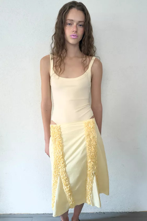 Bodysuit made from cotton blend yarn. Featuring a round neckline, thin straps and snap-button fas... | Zara UK