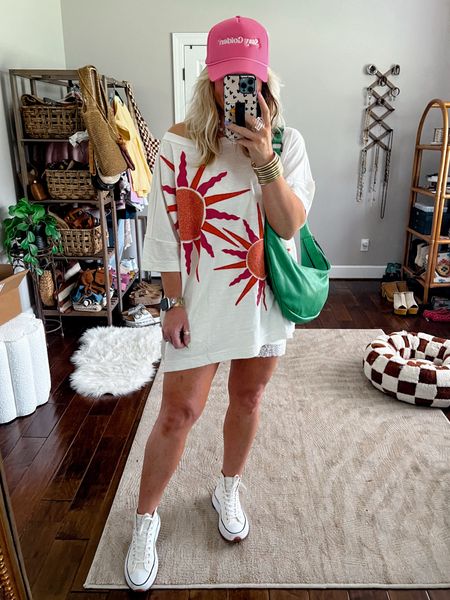 Date night casual style! 🔆💖 ✨💚
This oversized tee is so much fun! I love over it layered over this lace slip skirt! 
Made it super casual with my converse and a trucker hat! I love green with pink and orange so I decided to carry my new bag tonight because it’s so CUUTE!! 💚💚💚
🍋💧Love my waterproof watchband (SAVE with code MANDIE) 

#LTKOver40 #LTKFindsUnder100 #LTKItBag