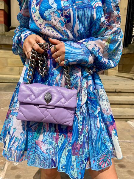 Details, details, details! This dress and my Kurt Geiger bag are the perfect combination of color and style. 💙💜 #FashionFaves #PrintPerfection #KurtGeigerStyle