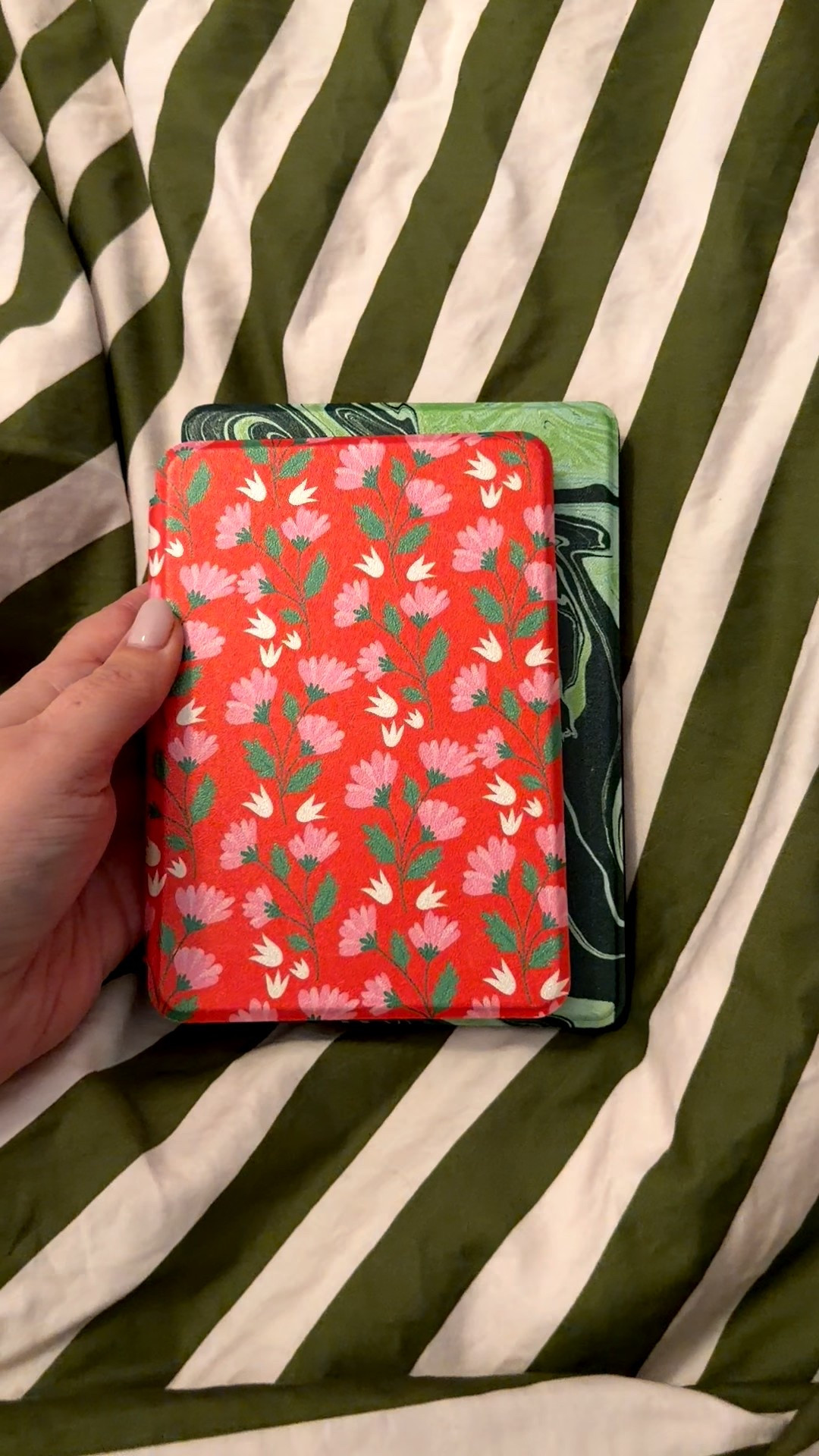 A kindle PaperWhite 11 (2022 edition, but about the same size as current PaperWhite) and the regular Kindle. If you're a casual reader, I think the regular Kindle is the way to go! I love how small it is. It's my purse kindle or travel kindle. 

The PaperWhite is bigger and I do like the screen better for reading. The dark. Plus, it's waterproof. 

I use Page the Shop cases (I have sooo many) and add a mag safe adhesive to the back of every case while the kindle is in it (so it sticks better). Then I buy a mag safe pop socket so I can switch out my casss regularly! I love a pop socket, but you don't need one with these cases since they come with a handle on the inside. I prefer pop socket though  