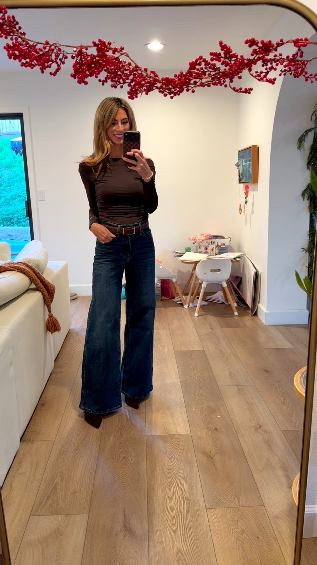 This is the best top & bottom combo! And both very affordable & perfect for holiday outings or date nights!! 

High waisted wide leg jeans, brown boots, black belt, date night outfit, holiday party outfit, brown top