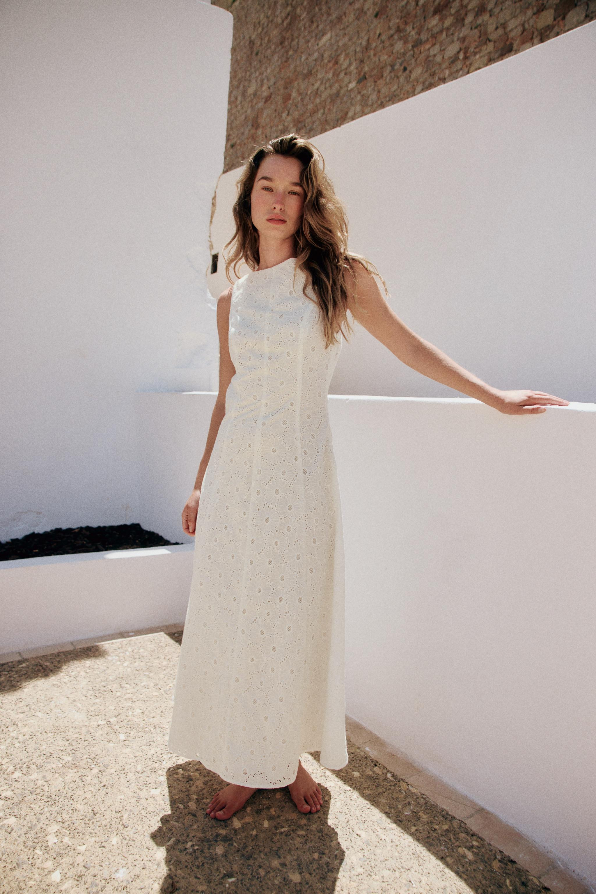 Boat neck midi dress with a back cutout and sleeveless design. Features eyelet embroidery detaili... | Zara US
