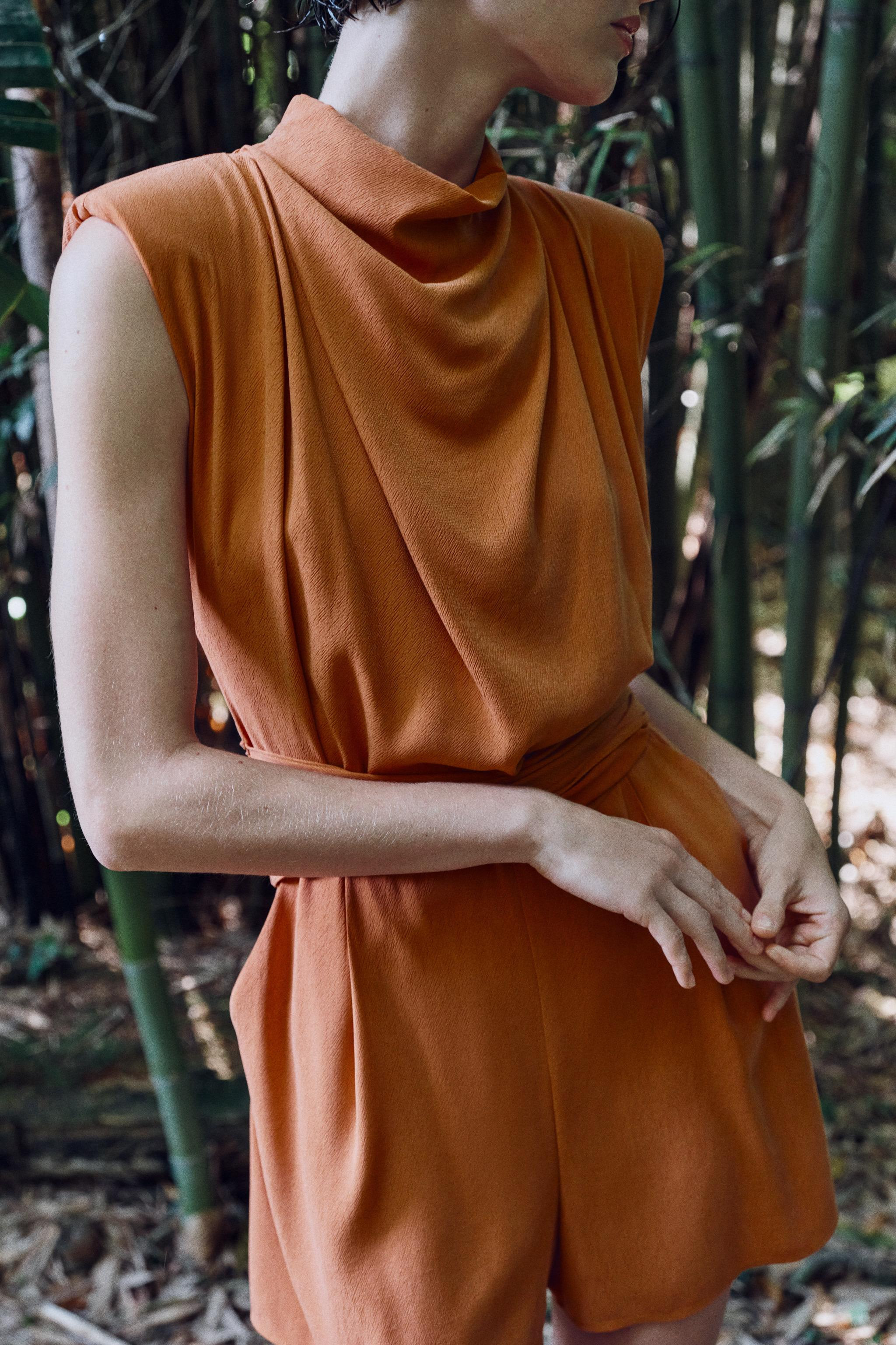 DescriptionContentsMeasurementsHigh-neck sleeveless jumpsuit with shoulder pads and pleats. Featu... | Zara US